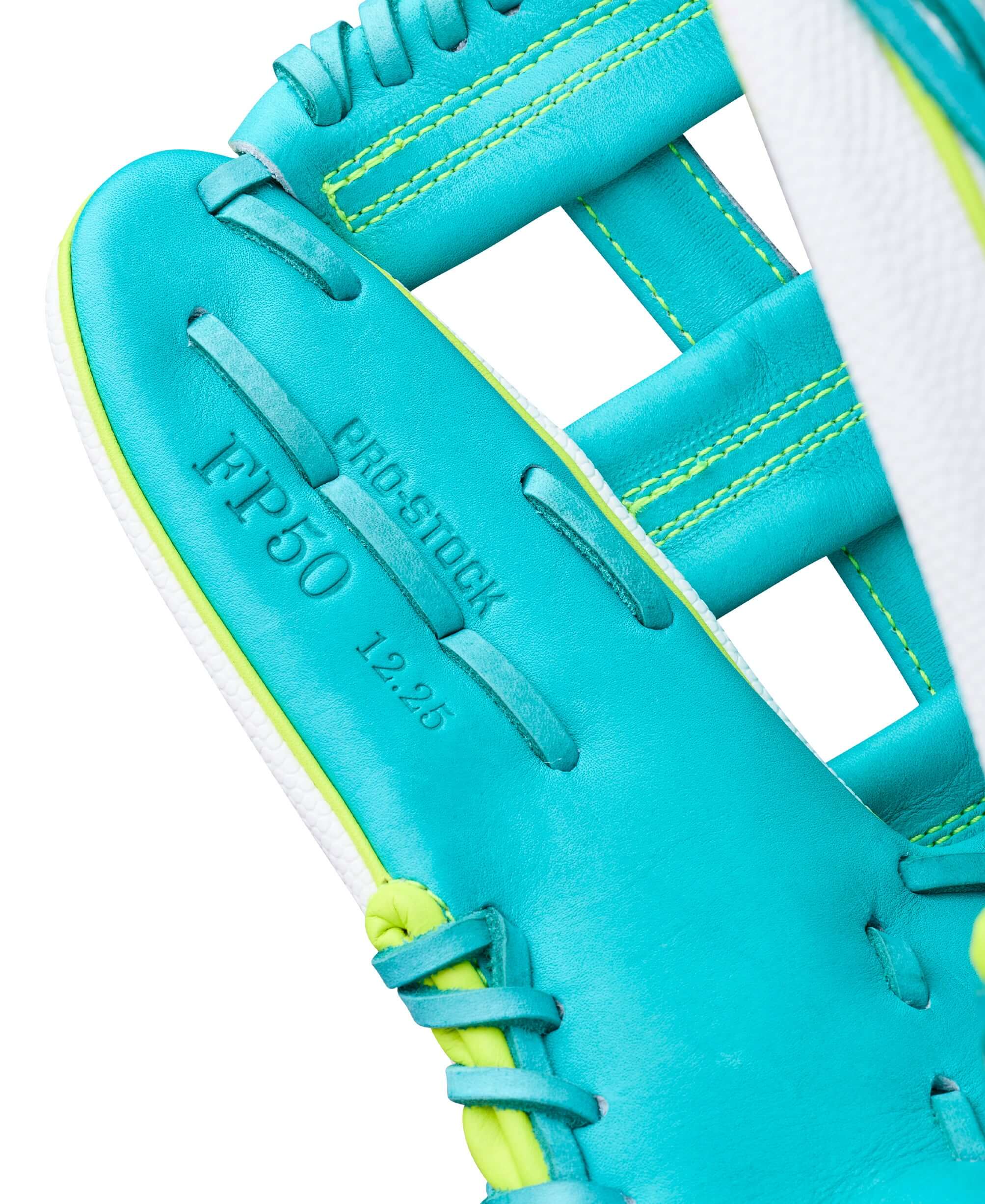 Close-up of teal webbing and FP50 stamping on Wilson Spring 2026 A2000 FP50SS 12.25” Outfield Fastpitch Softball Glove LHT.