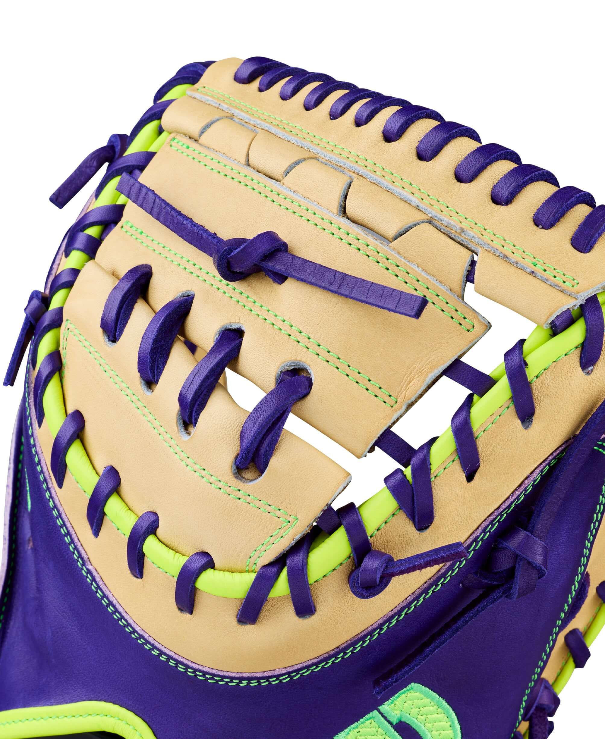 Wilson Spring 2026 A2000 FPCM23 34” Fastpitch Softball Catcher’s Mitt web detail with purple lacing and neon green stitching.