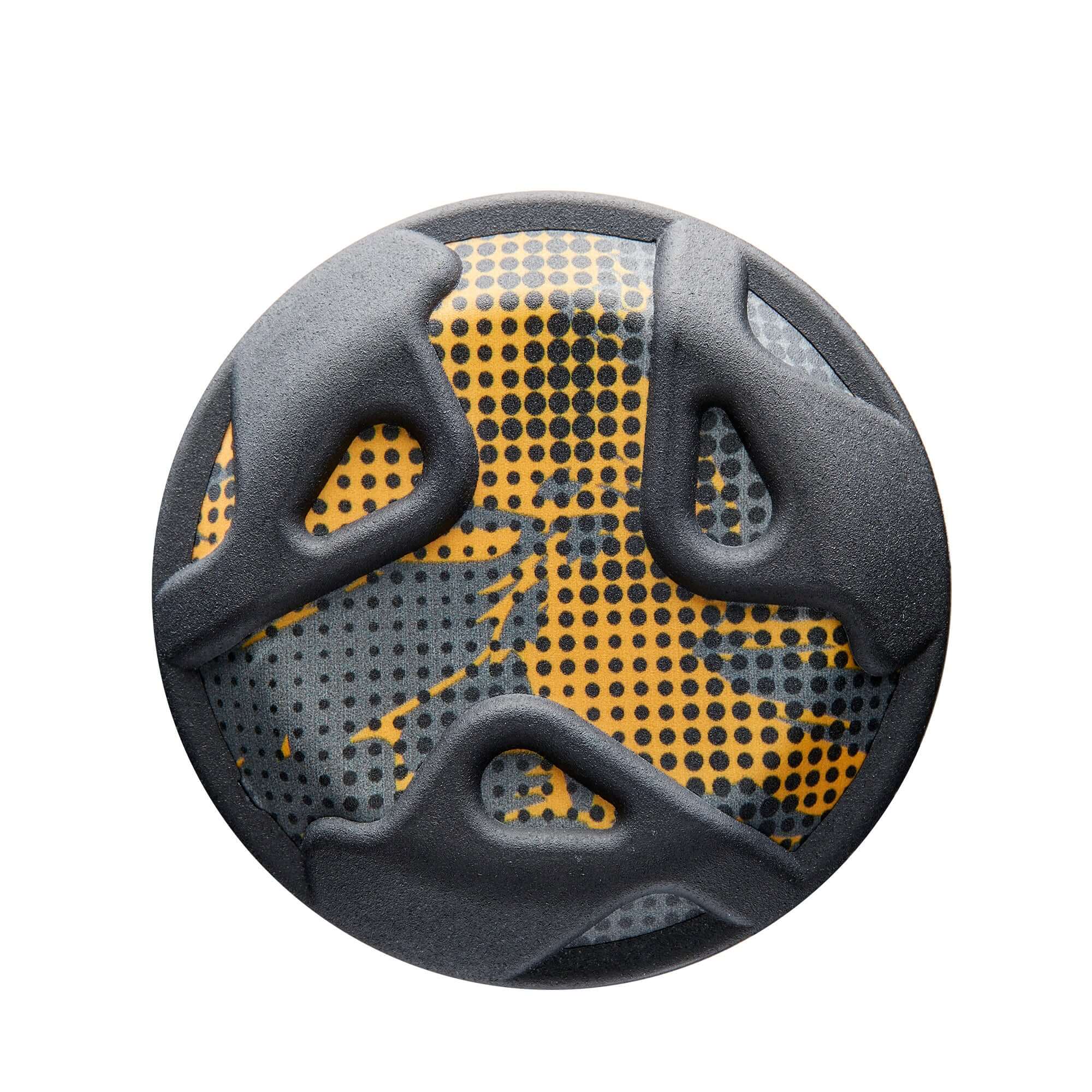Top view of a black and yellow patterned sports grip, featuring ergonomic cutouts for enhanced functionality.