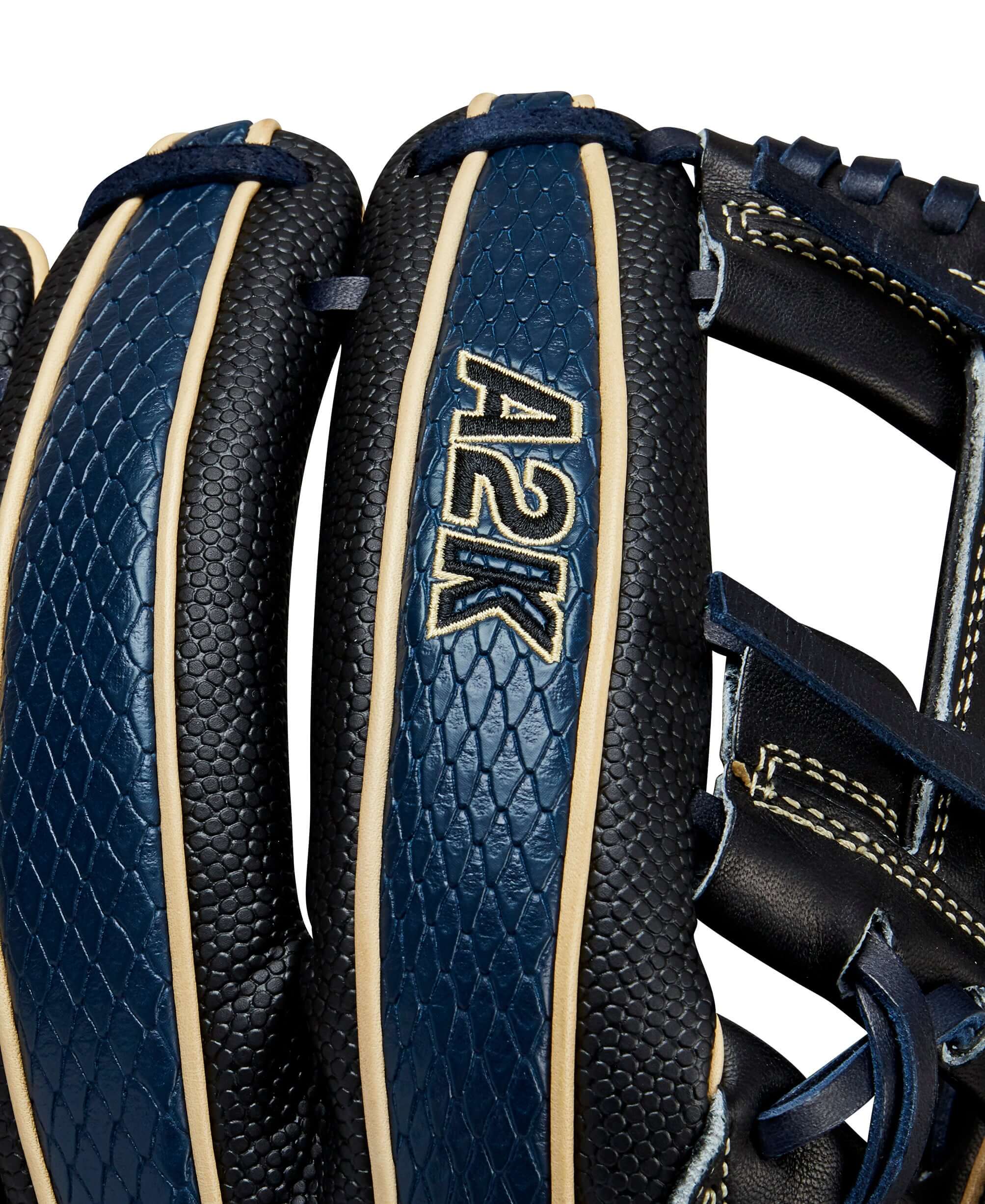 Close-up of Wilson A2K glove featuring Navy SuperSnakeSkin™ and Black Pro Stock® leather with bold logos.