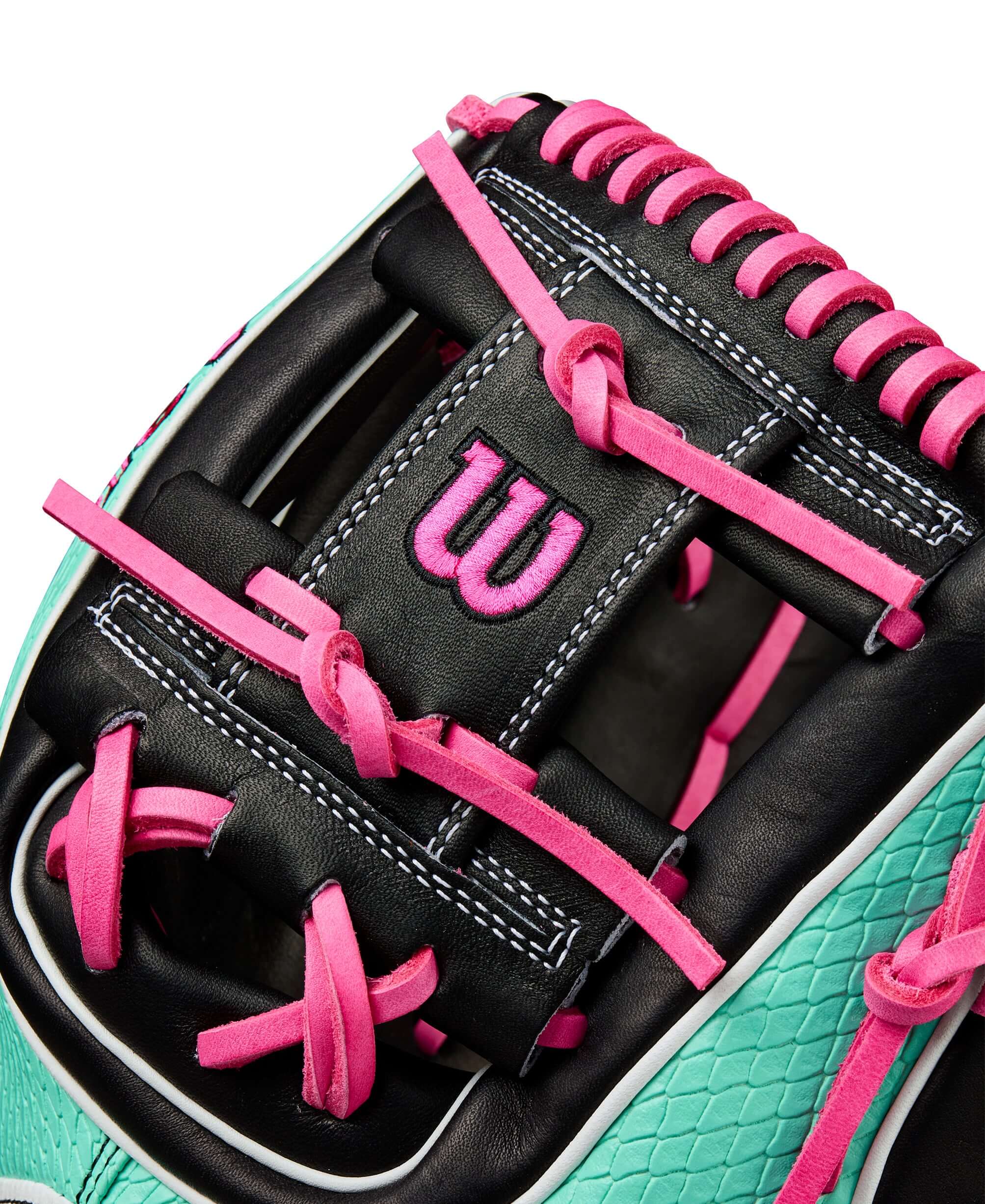 Close-up of Wilson Summer 2025 A2K 1720SS infield glove showing black leather and pink lacing details.