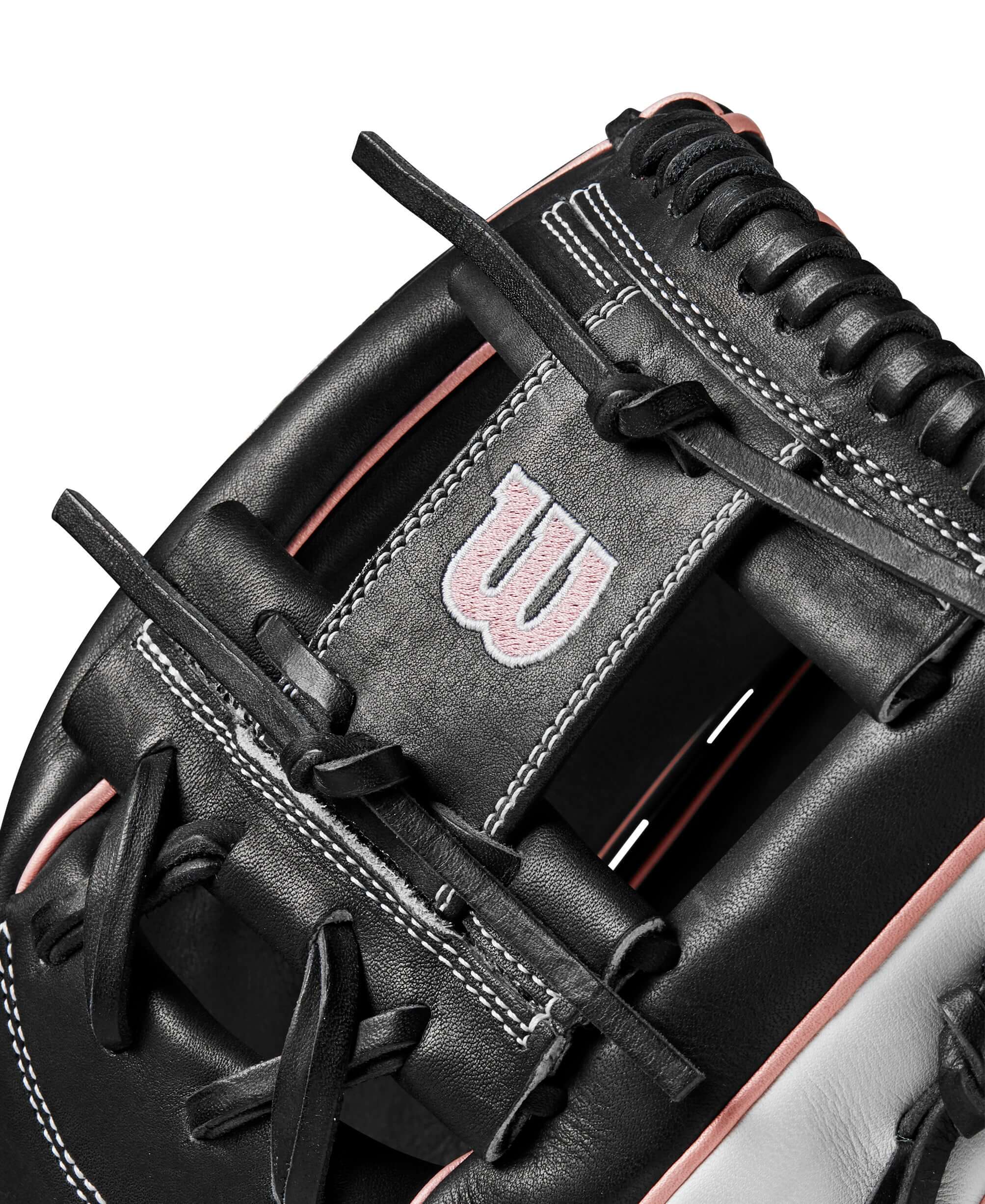 Close-up of the Wilson 2024 A2000FP H12 infield glove showing black leather and pink details, highlighting craftsmanship and design.