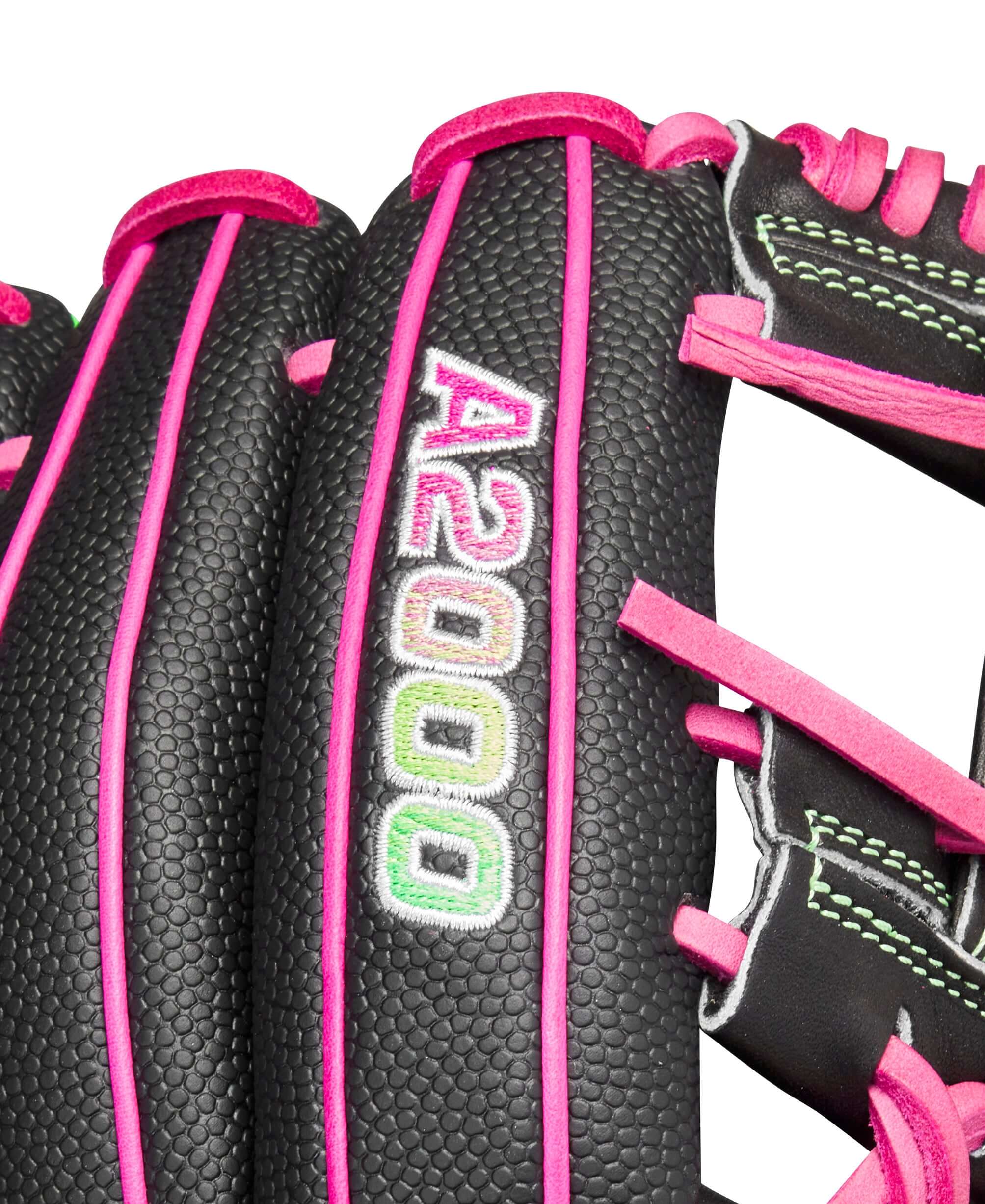Close-up of Wilson A2000® 1975 Party Time glove with vibrant pink accents and durable Black Pro Stock® leather.