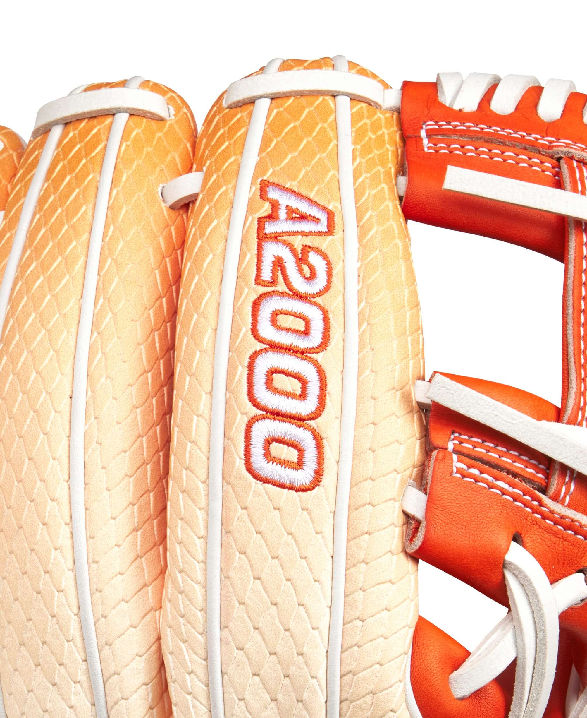 Close-up of Wilson A2000 1975SS infield baseball glove showcasing its citrus color and signature design.