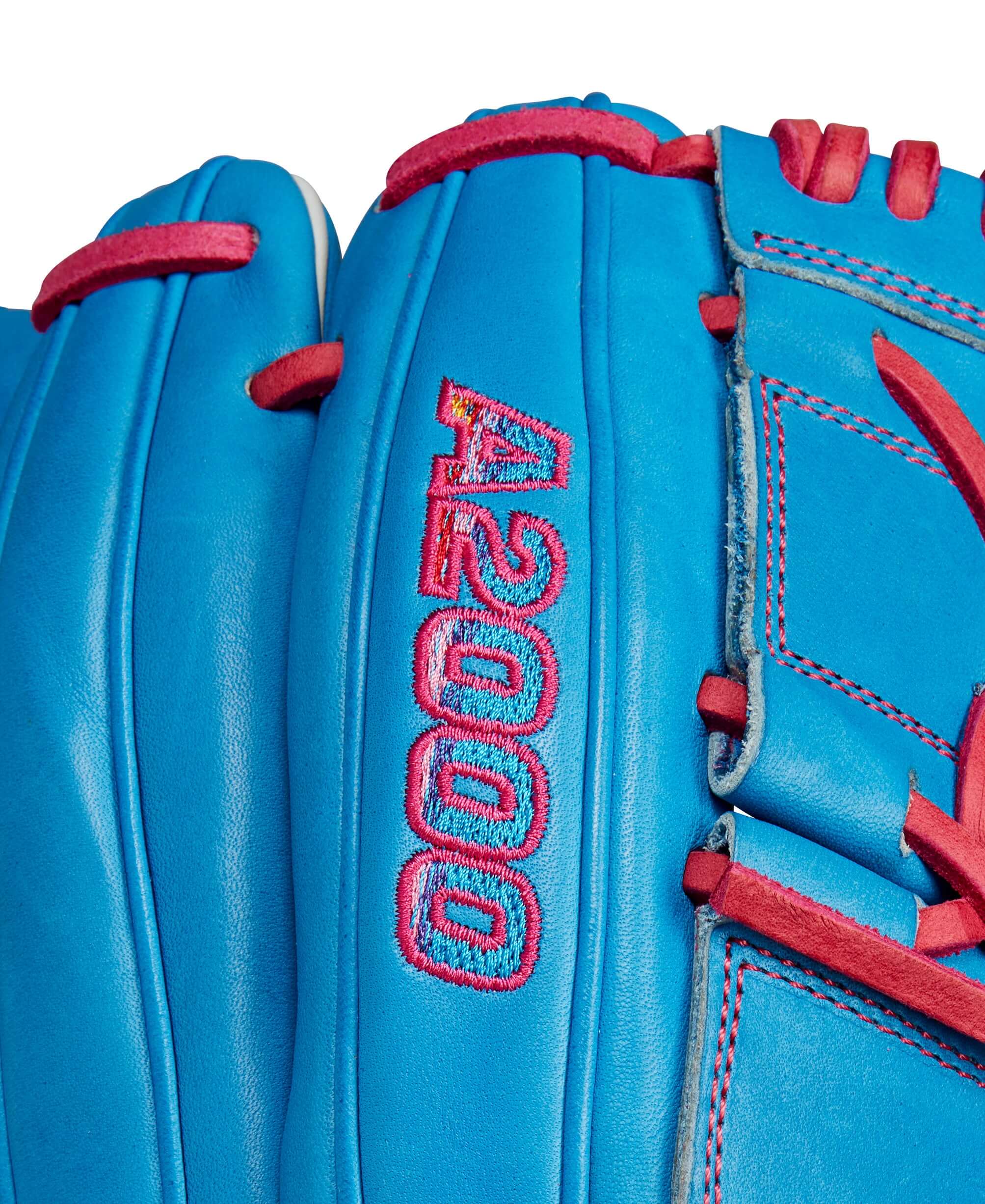 Wilson A2000 B2 baseball glove showing Autism Speaks Blue leather and pink stitching details.