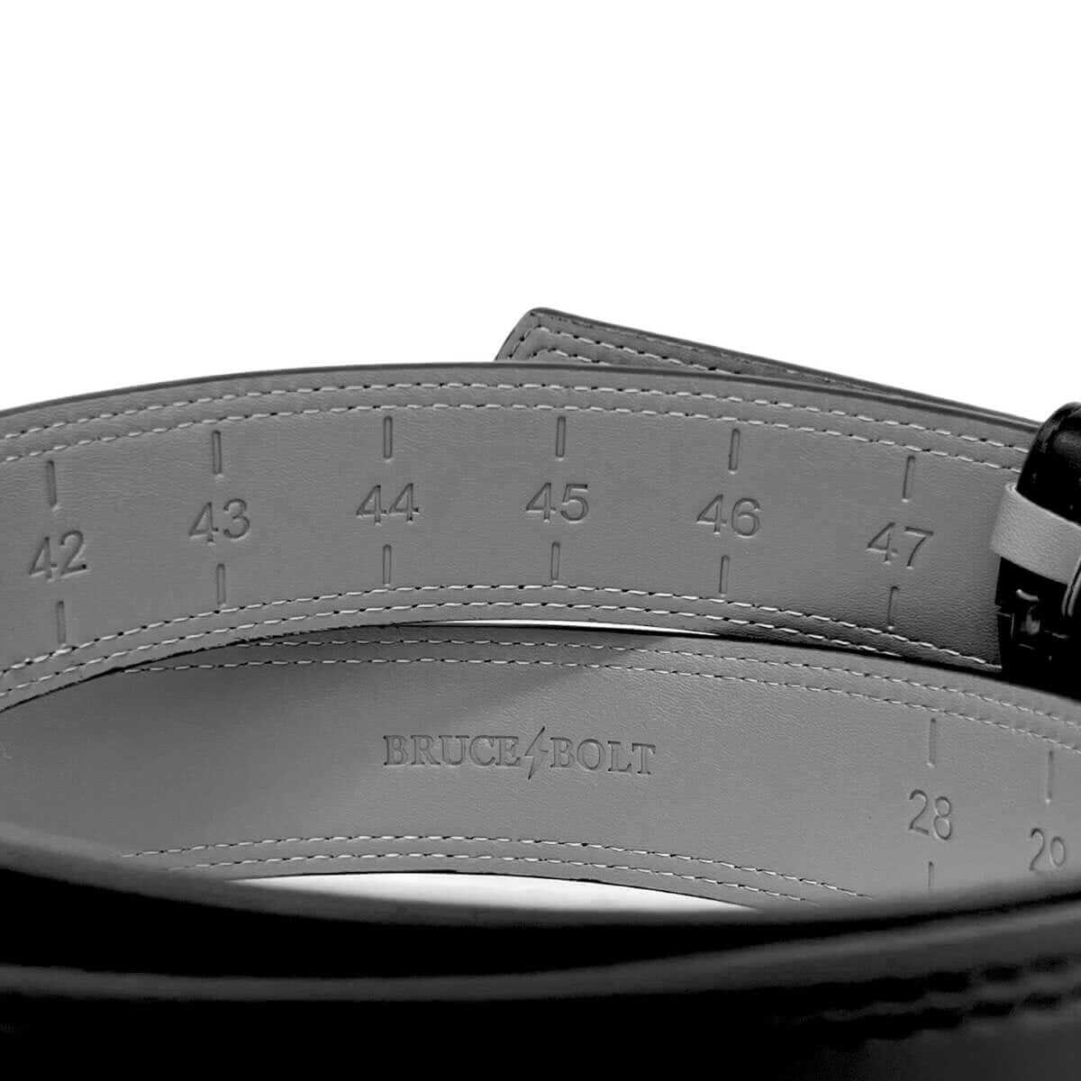 Interior view of the Bruce Bolt Adjustable Belt in Black showing measurement markings and logo for perfect fit.