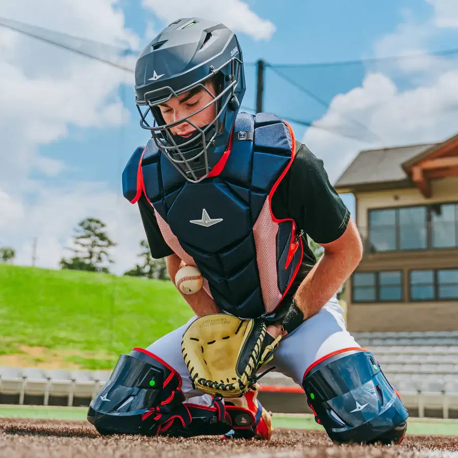 Catcher wearing All-Star MVP-PRO™ Chest Protector / NOCSAE / Small BK/BK, crouching on field.