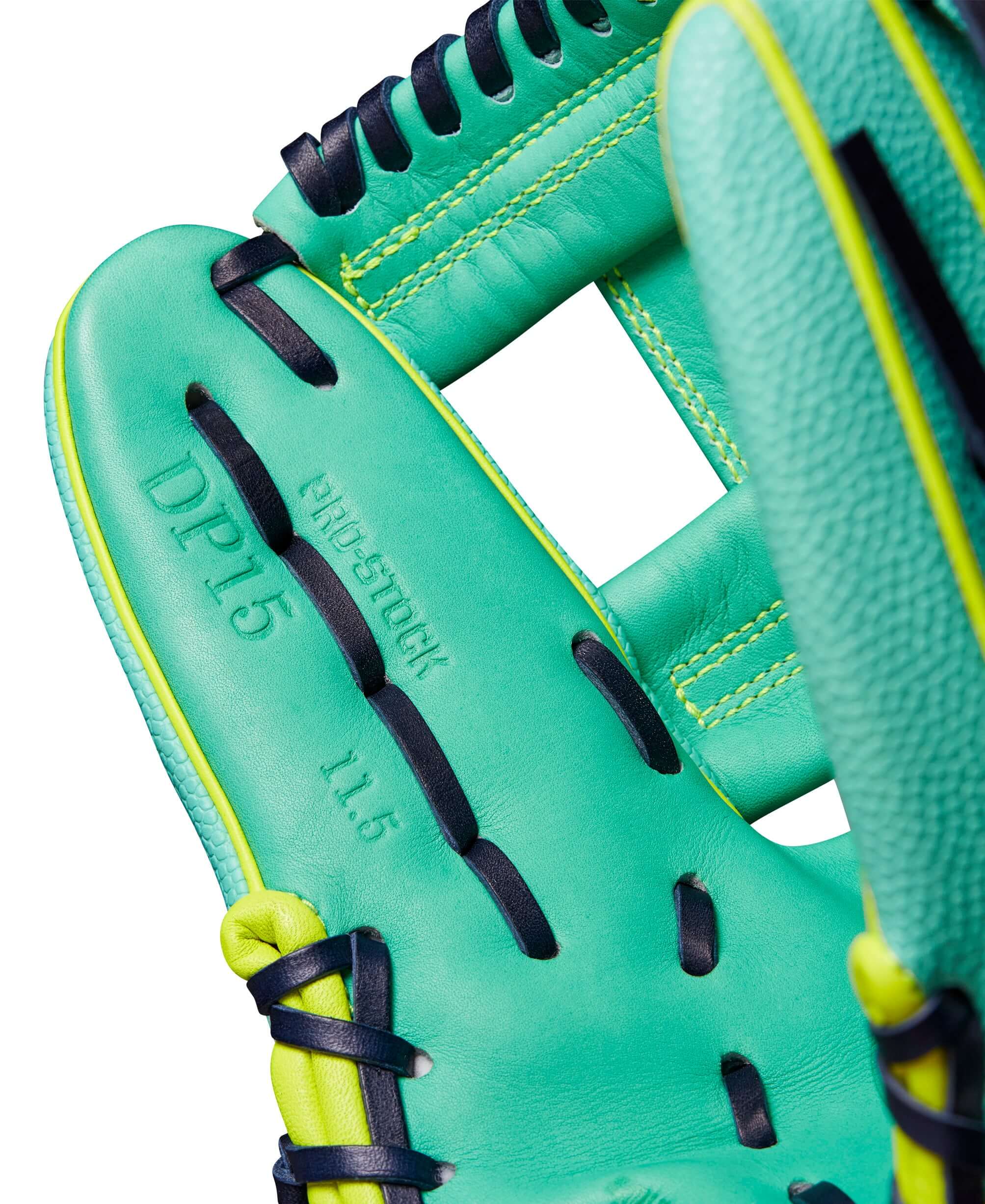 Close-up of the Wilson A2000 DP15SS glove interior, featuring Seafoam leather and Optic Yellow accents, size 11.5".