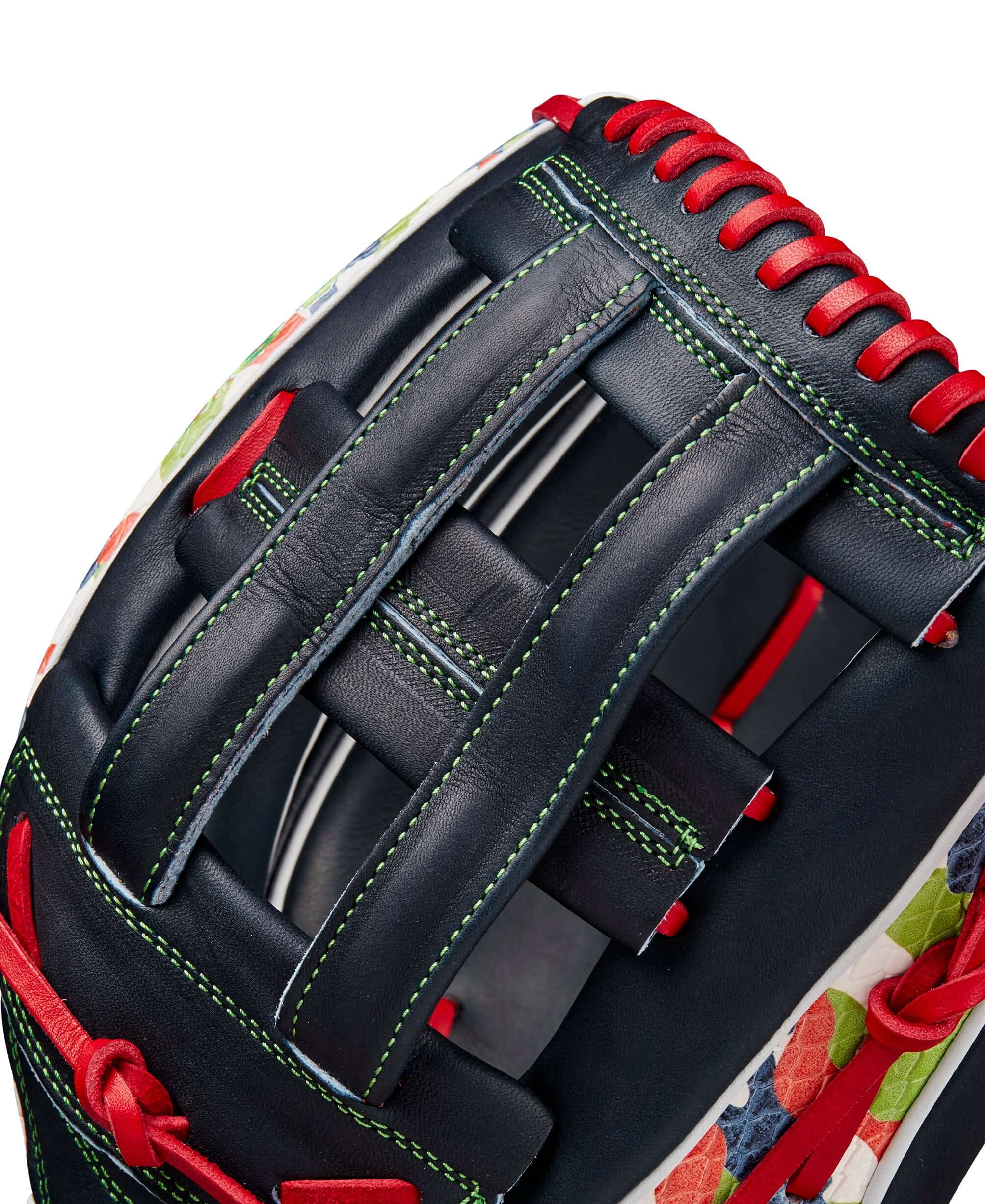 Close-up of Wilson A2K MH23 outfield glove showcasing the Dual Post Web design and vibrant color accents.