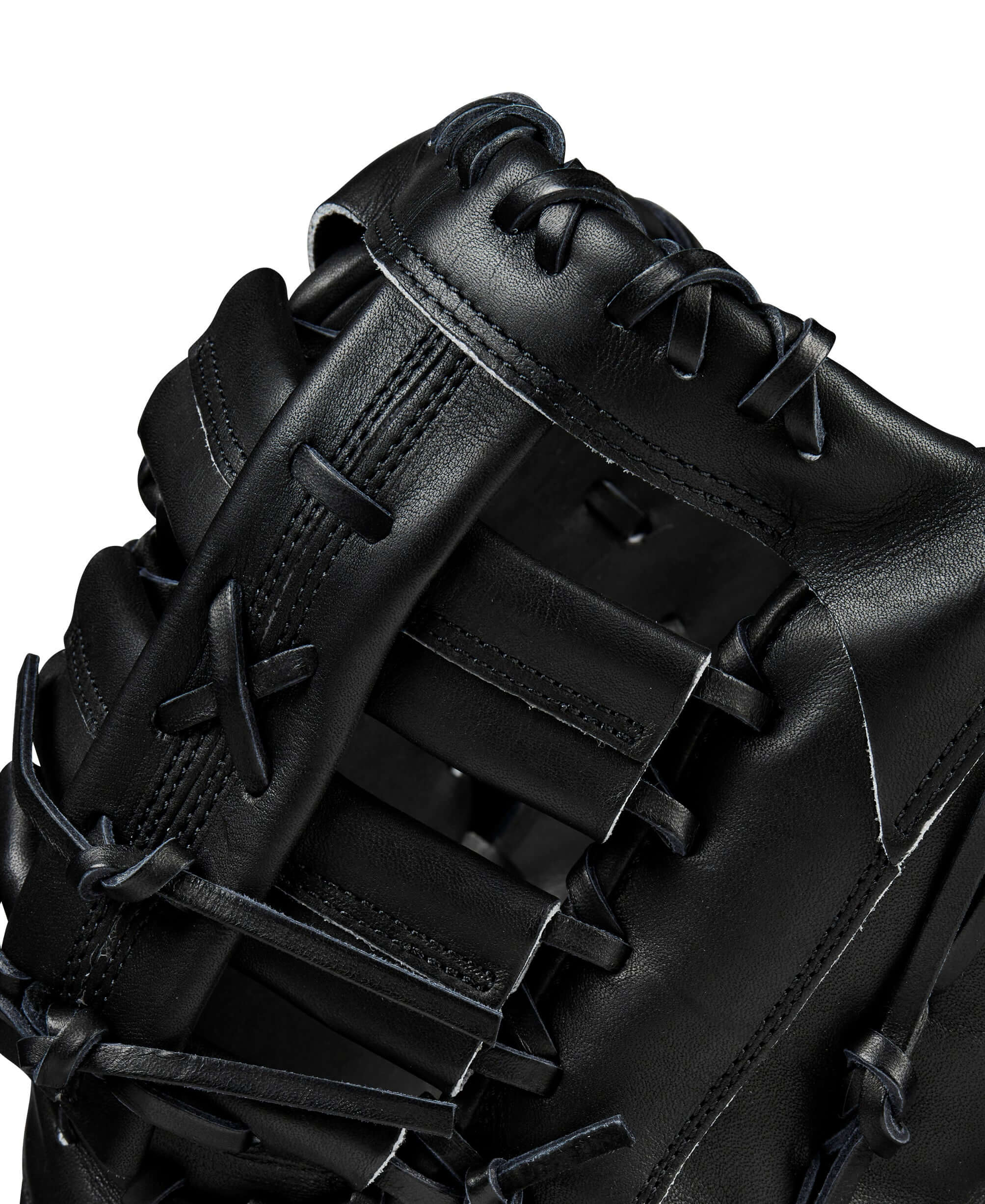 Close-up of the Wilson A2000 1679 baseball mitt showcasing black leather and reinforced lacing details.