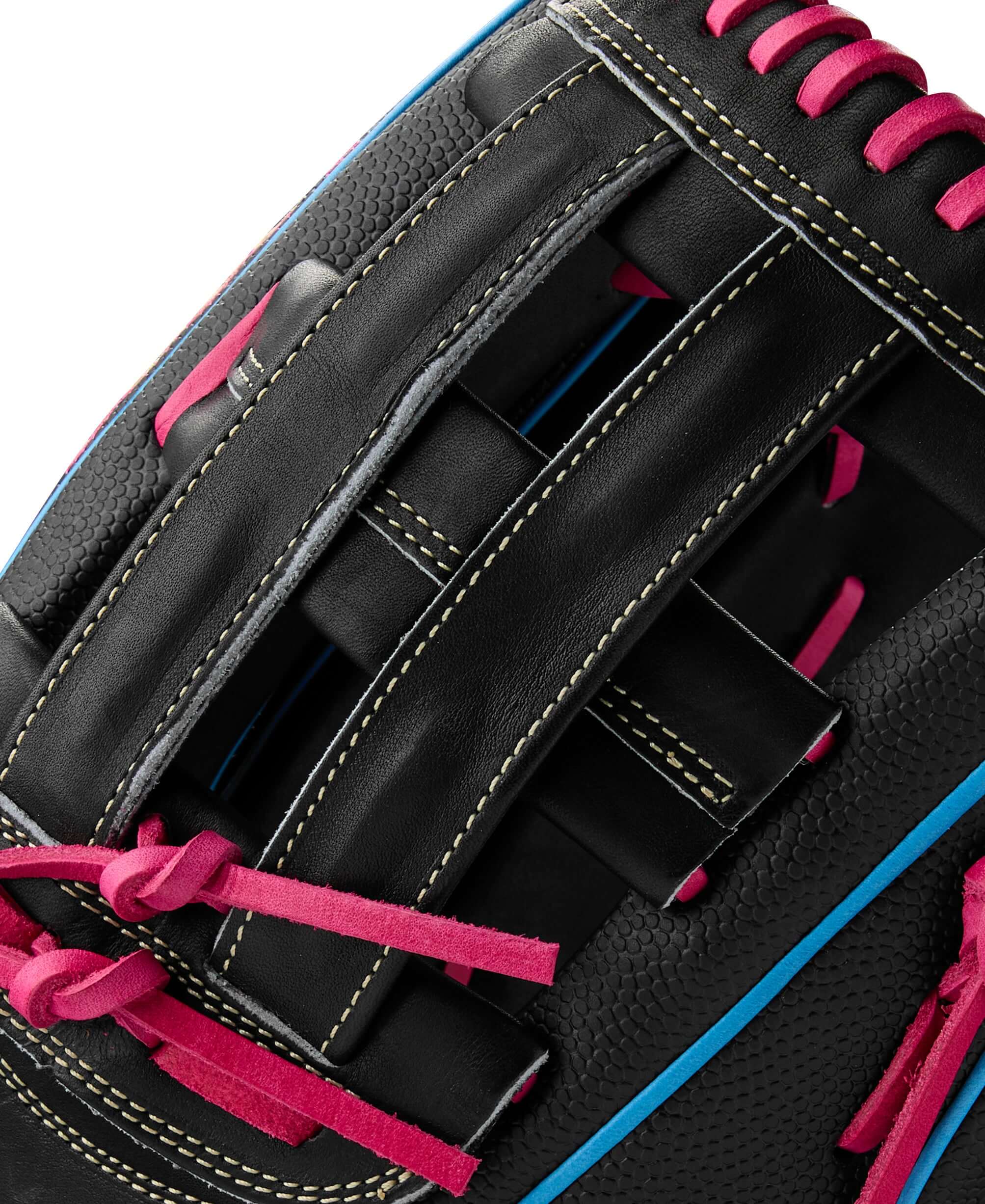 Close-up of the Wilson A2000 1777SS baseball glove showing its black leather and pink lacing details.