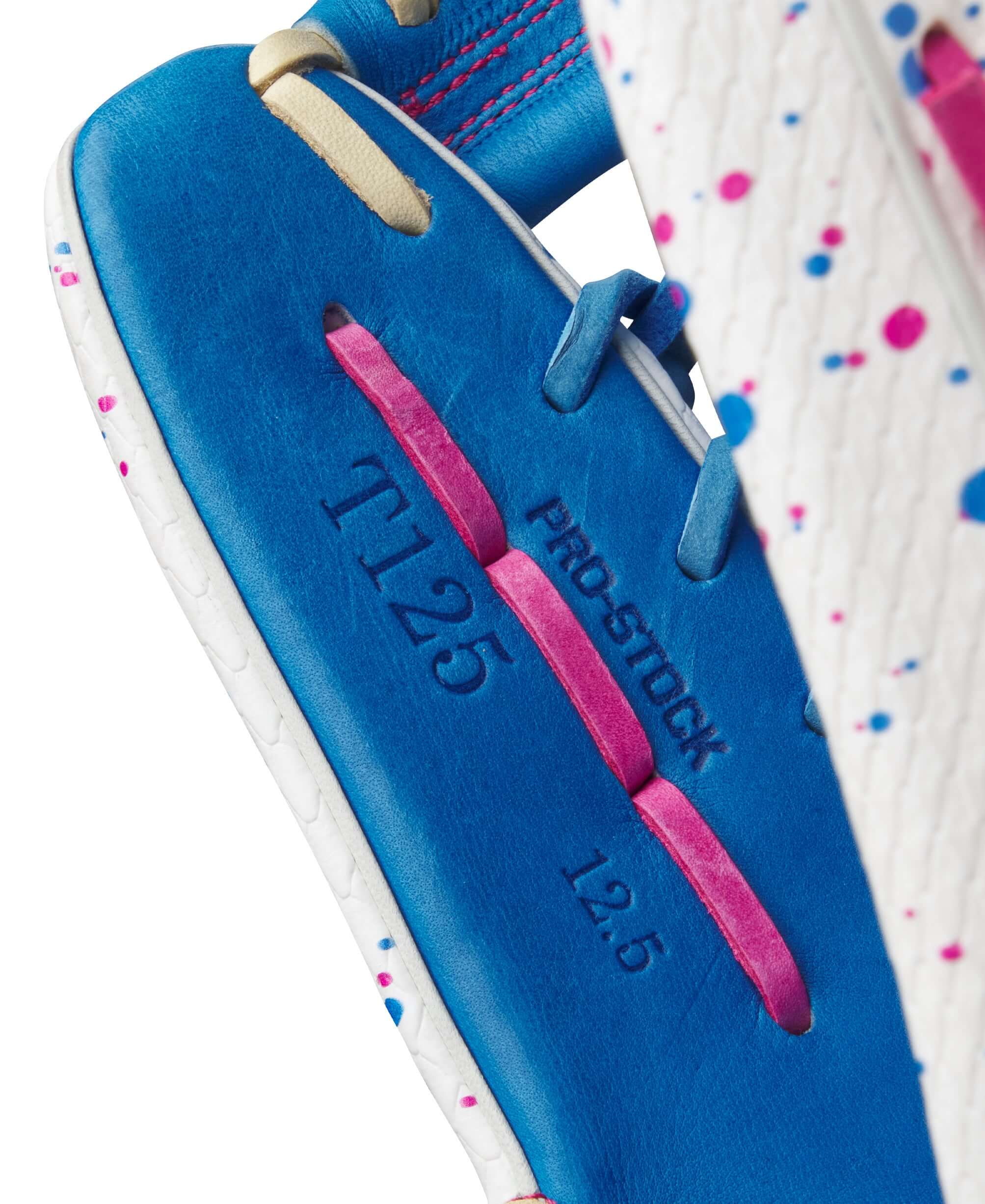 Close-up of Wilson A2000 T125SS outfield softball glove, showcasing Pro Stock leather and vibrant design.