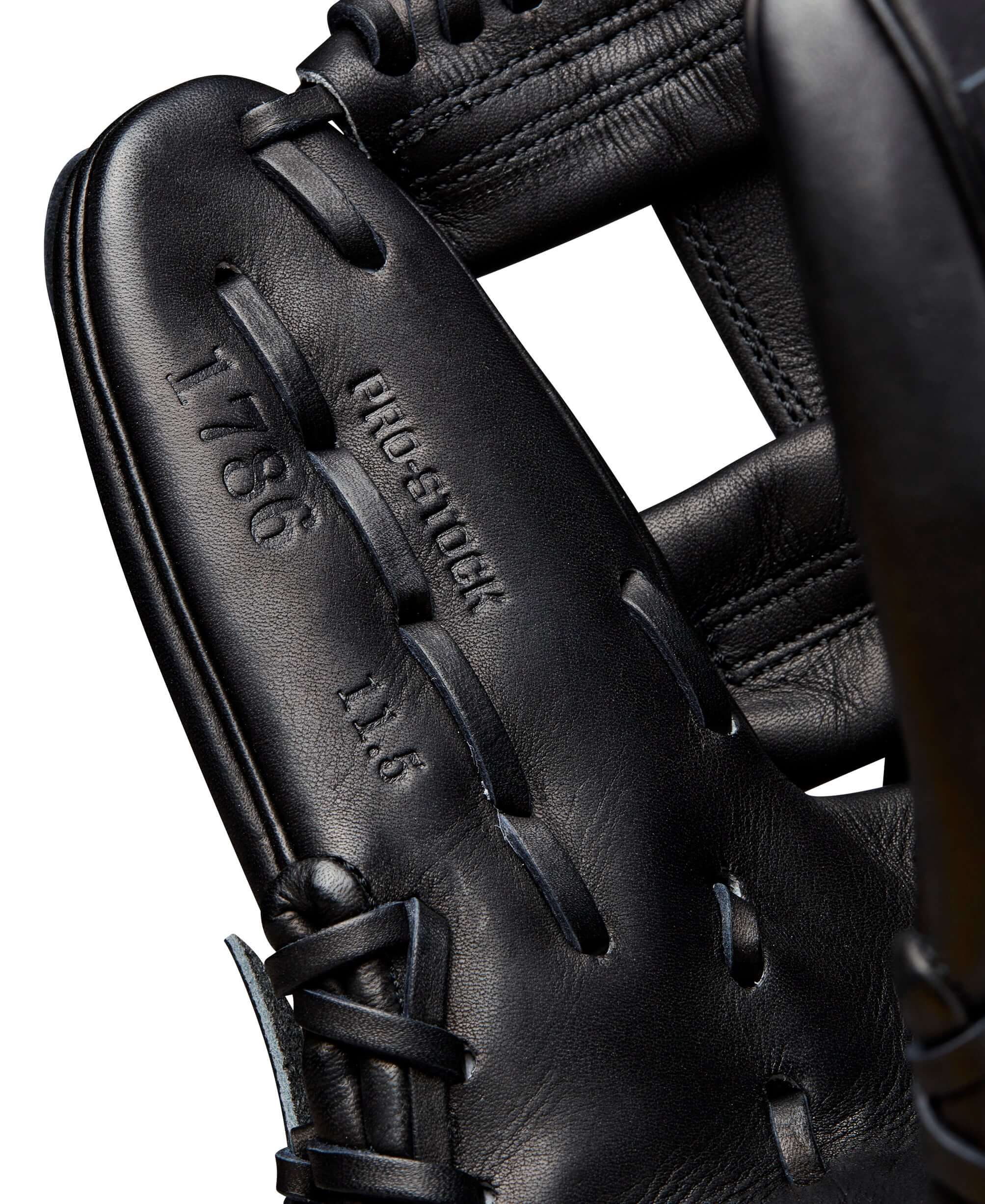 Close-up of Wilson A2000 1786 glove featuring Pro Stock® leather, showing model details and sleek black design.