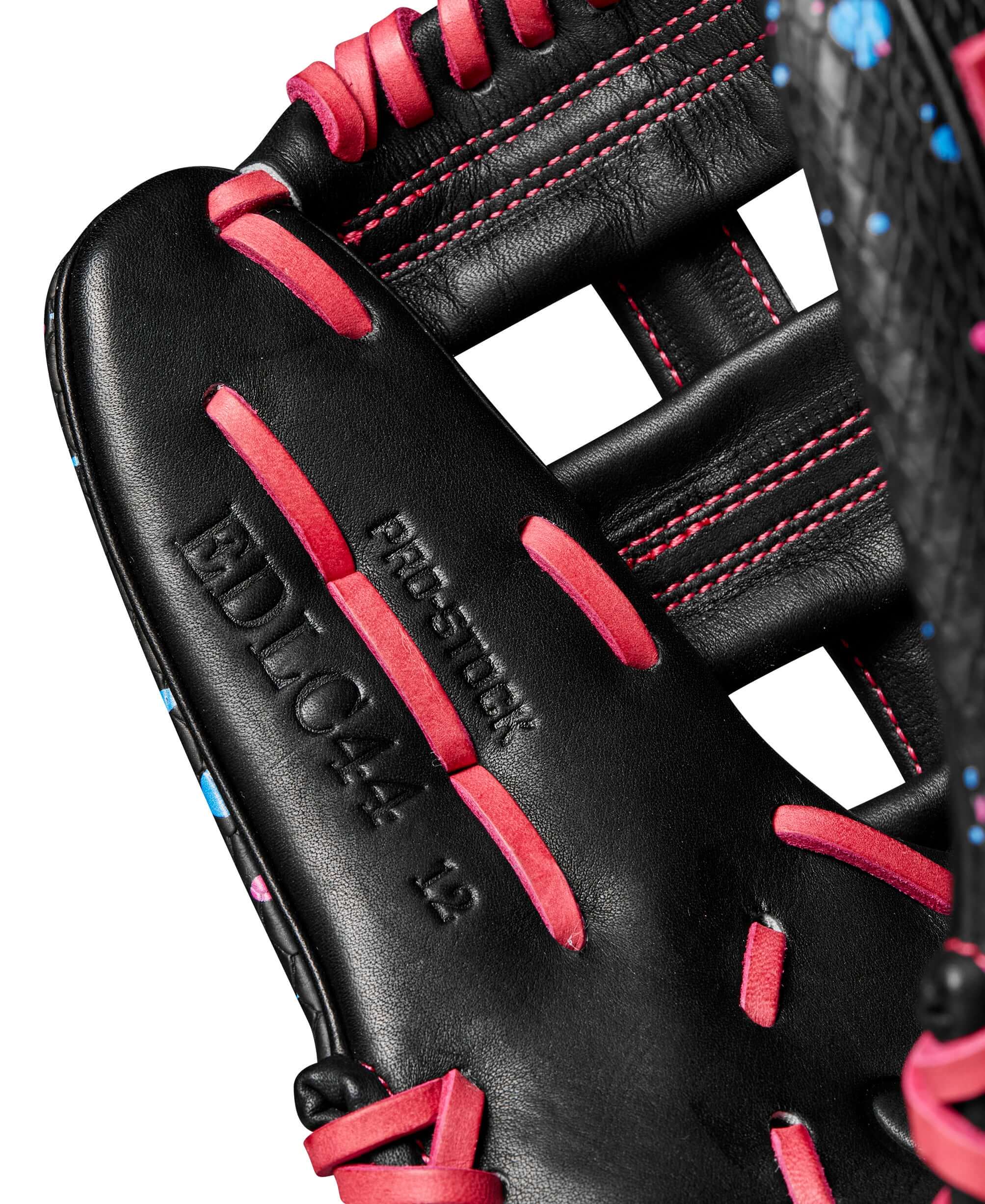 Close-up of the Wilson A2000 Elly De La Cruz infield glove showing pink and blue accents and Pro Stock label.