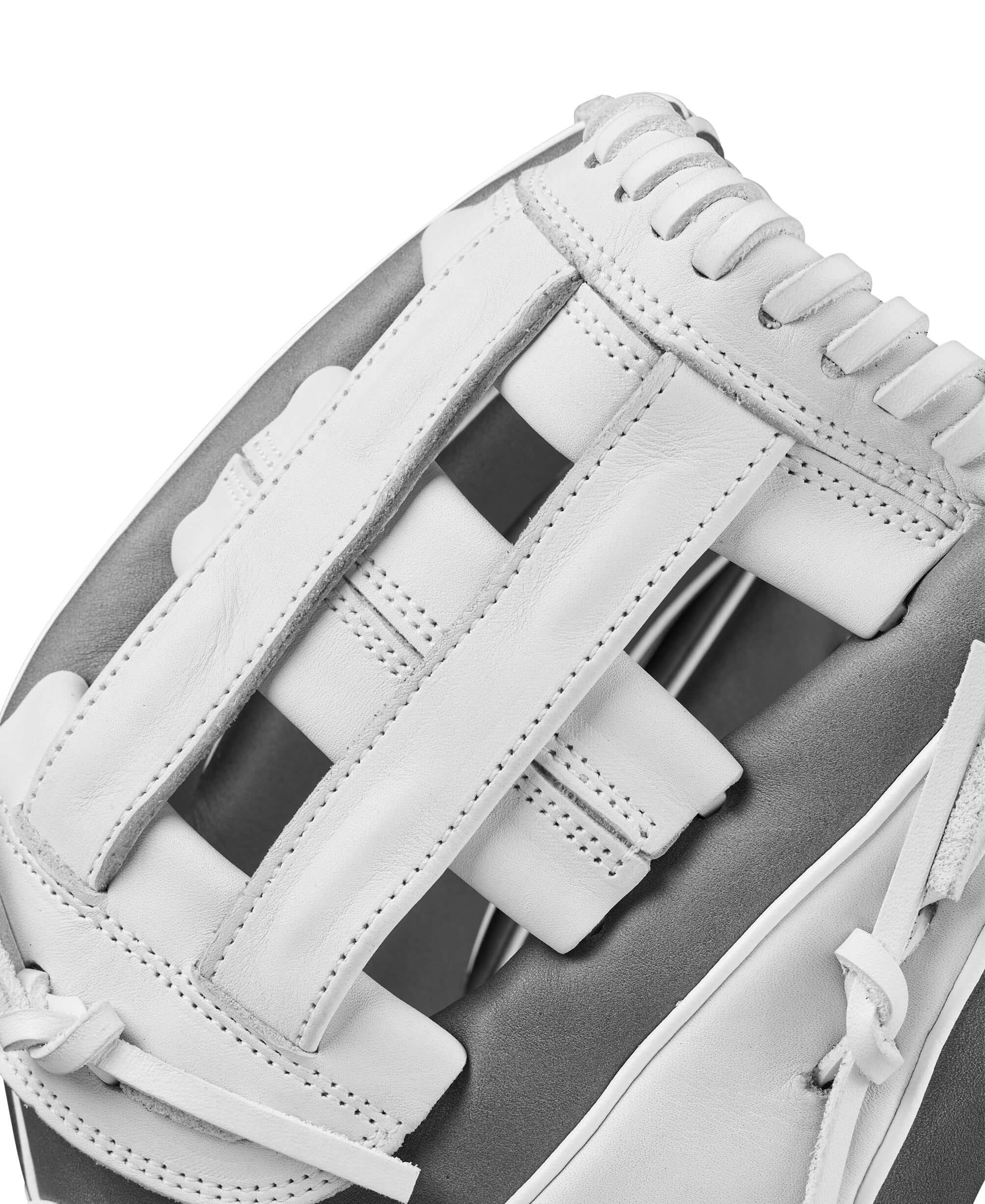 Close-up of Wilson A1000 IF12 fastpitch softball glove showing Dual Post Web design in white and grey.