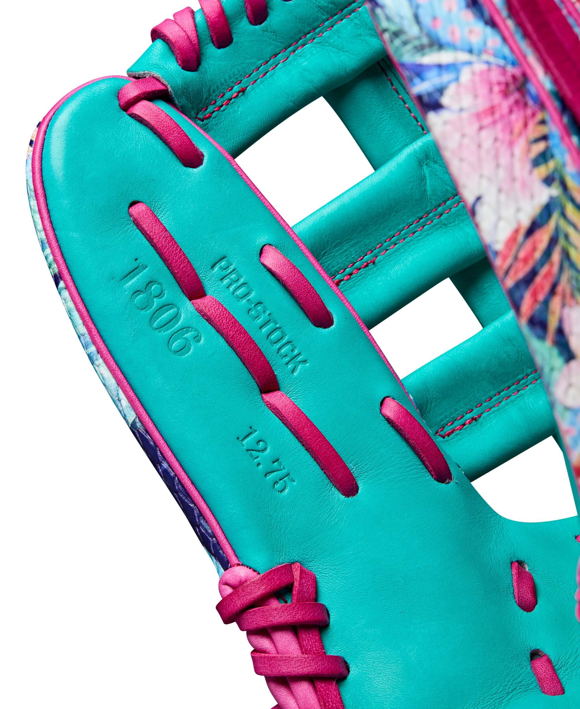 Close-up of the teal and floral Wilson A2000 Randy Arozarena glove featuring Pro Stock leather and 12.75" size.
