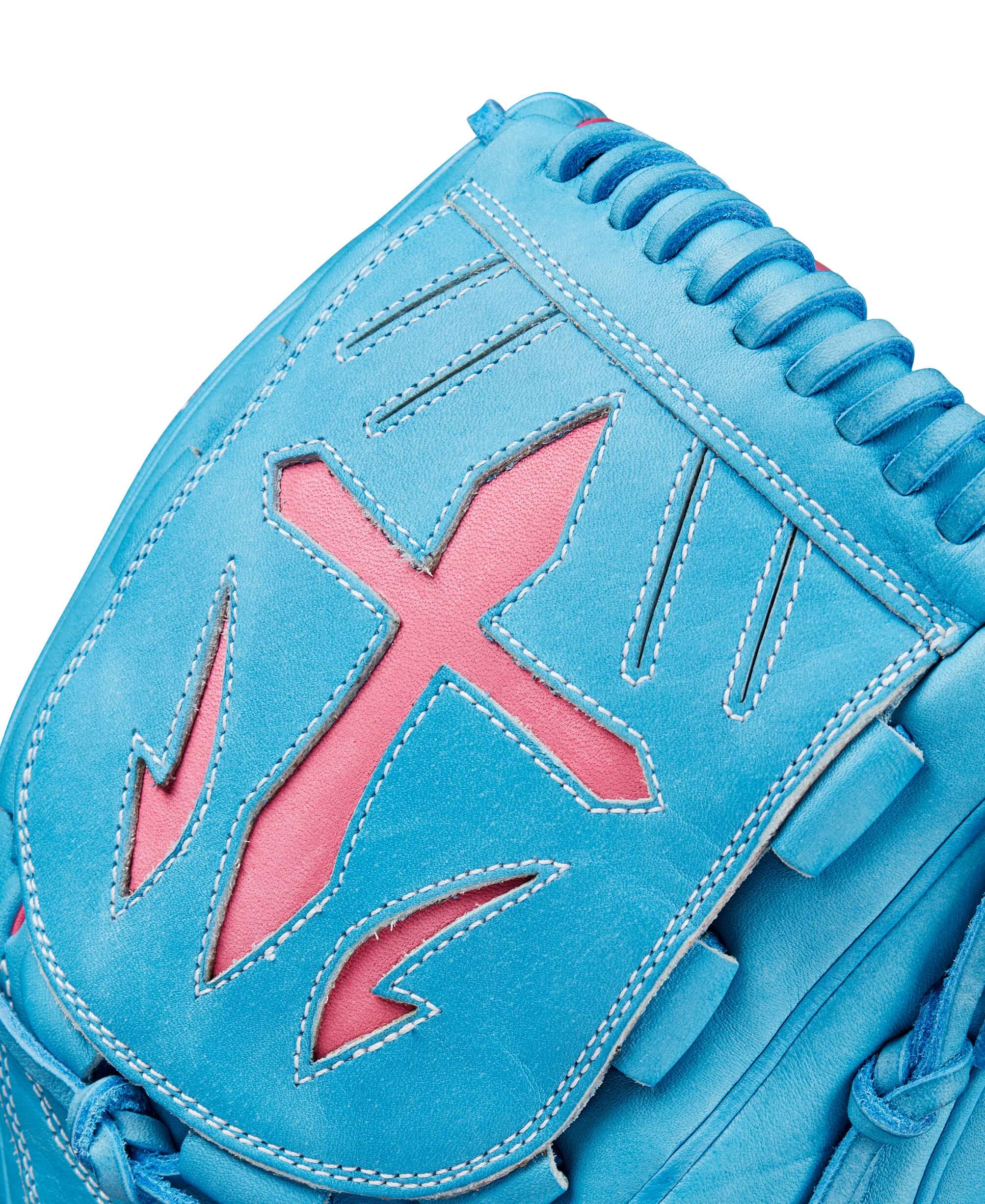 Close-up of Wilson A2000 B23 pitcher glove in Sky Blue and Flamingo Pink with unique design details.
