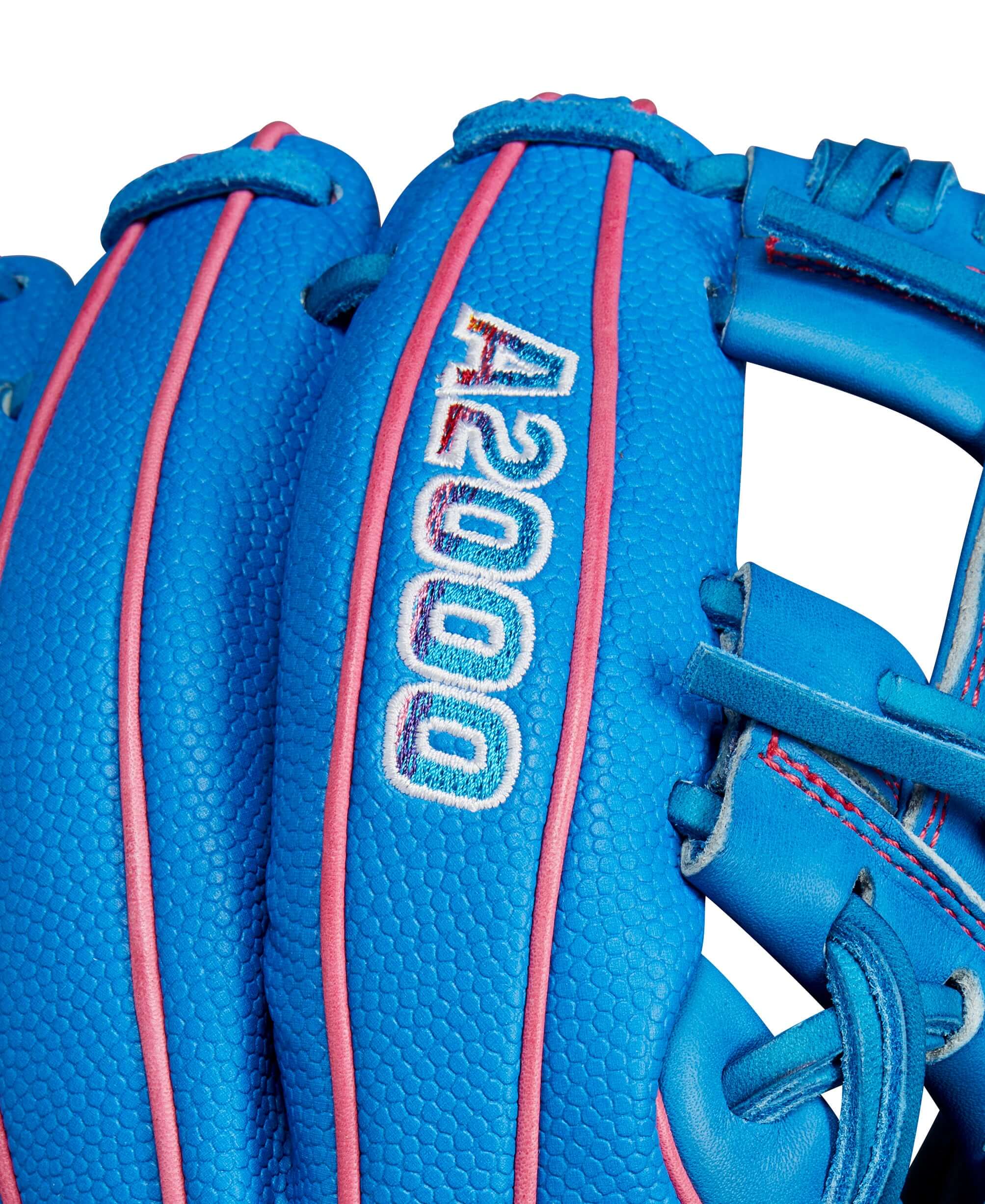 Close-up of Wilson A2000 Autism Speaks infield glove showcasing blue leather and pink accents.