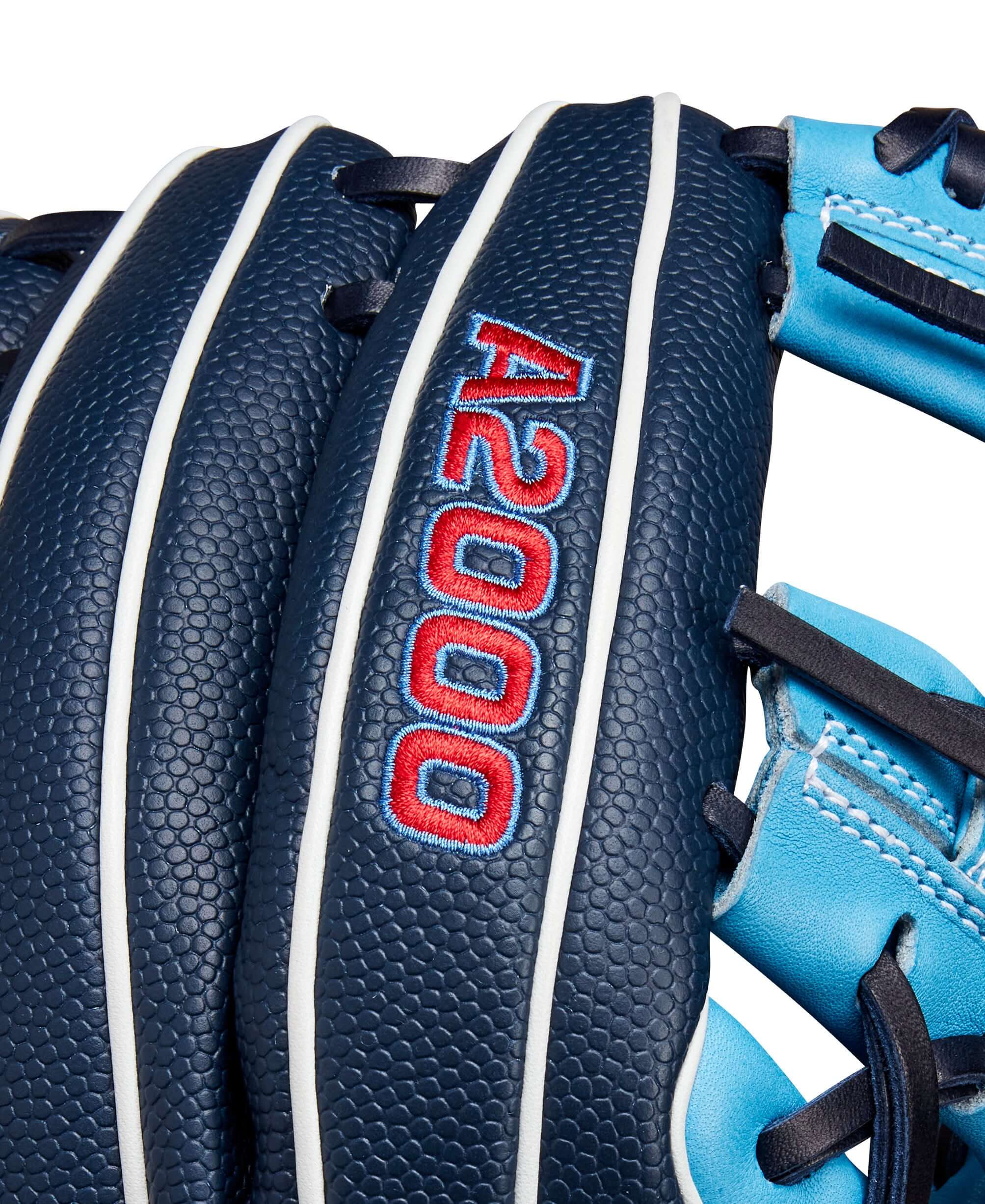 Close-up of Wilson A2000 PF88SS glove showing navy leather and Sky Blue accents, designed for smaller hands.