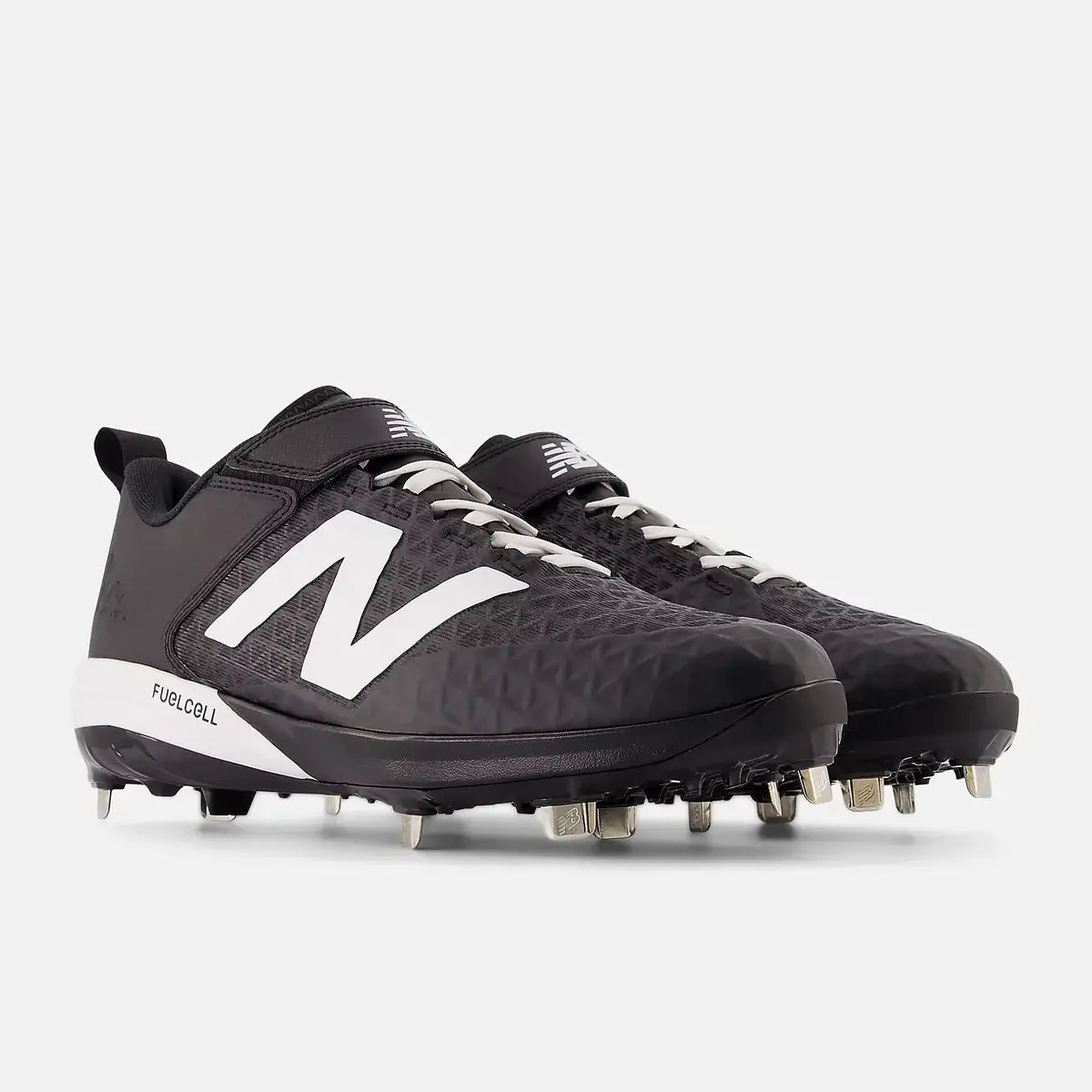 Angled view of New Balance FuelCell 4040 V8 Cleats in black, showing stud pattern and black lacing system with white logo accents.