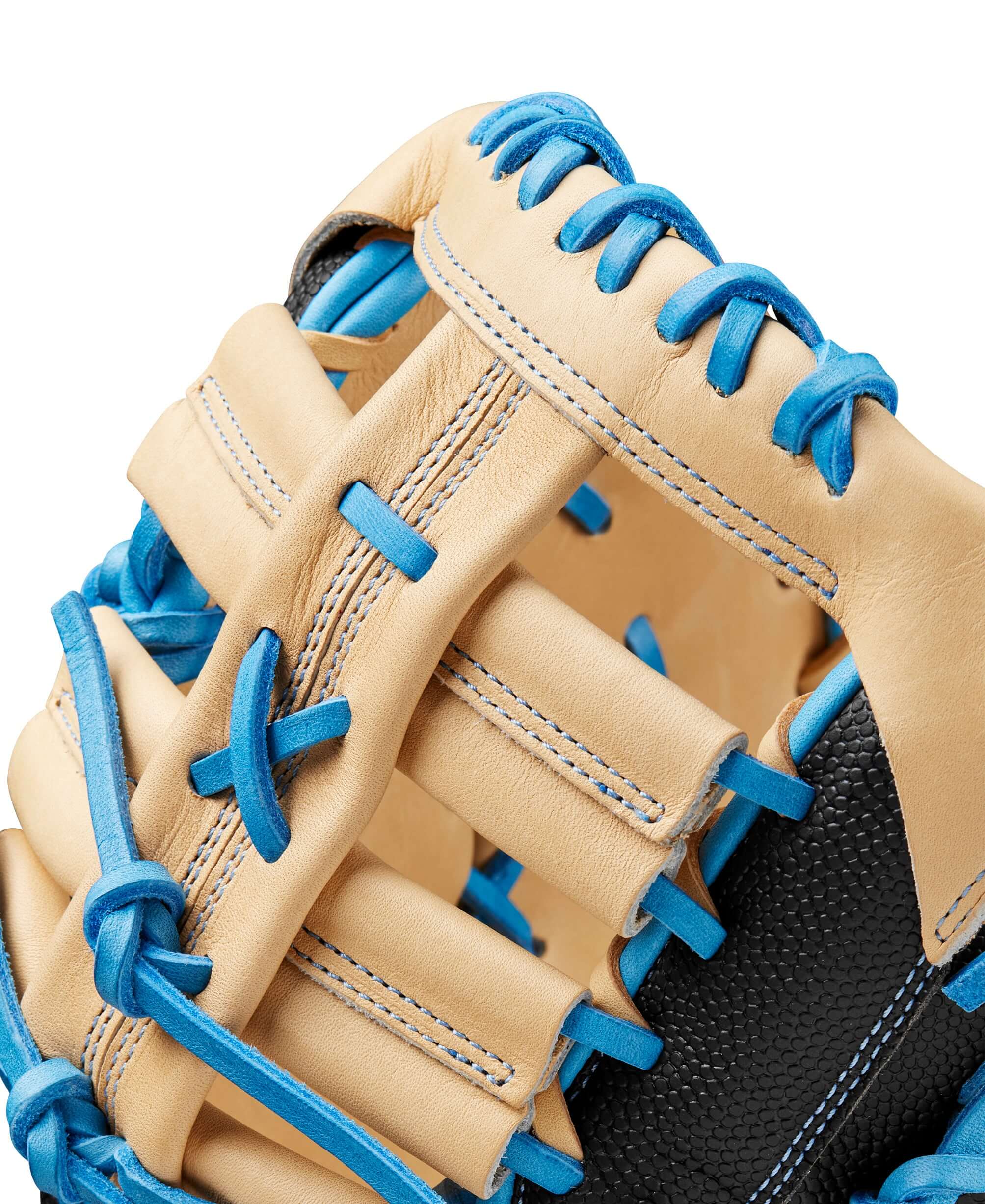 Close-up of Wilson A2000 1679SS baseball mitt showcasing Blonde Pro Stock leather and blue lace detailing.