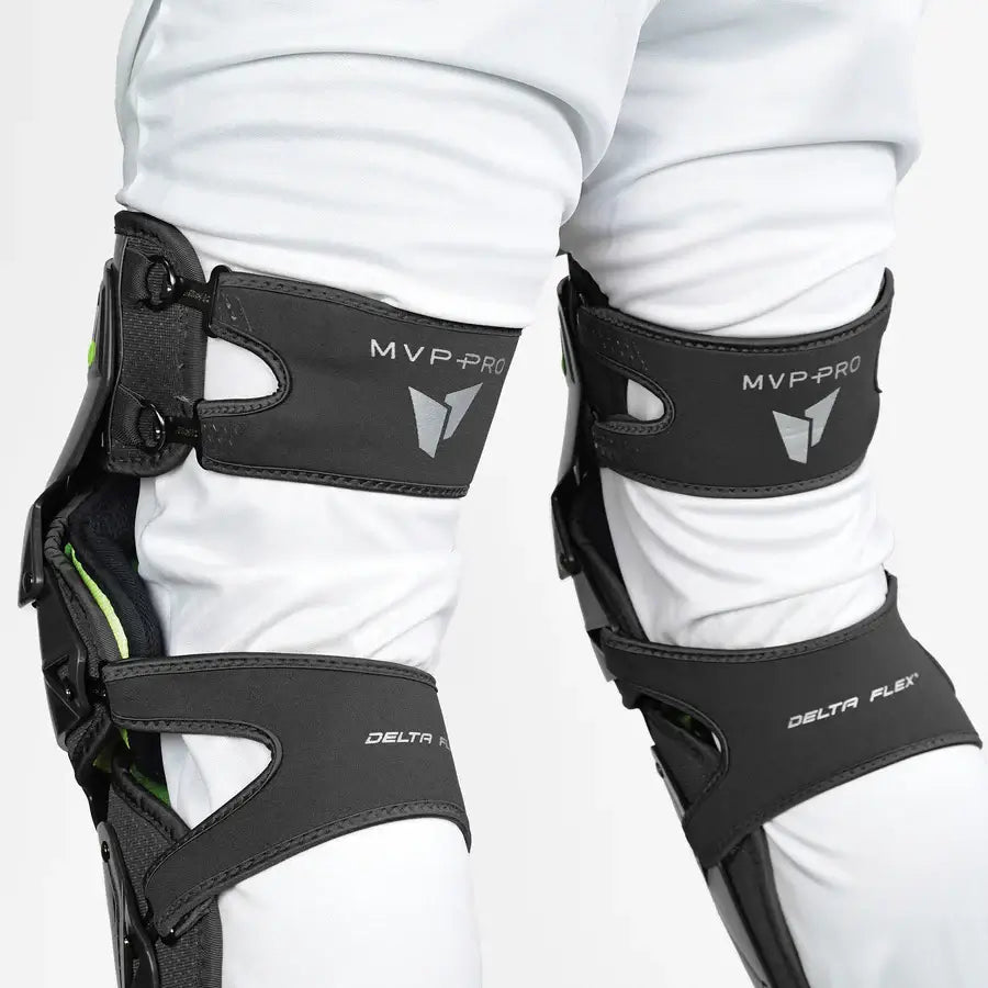 Side view of All-Star MVP-PRO™ Catcher Leg Guards in Black/Black, highlighting adjustable straps and knee protection.