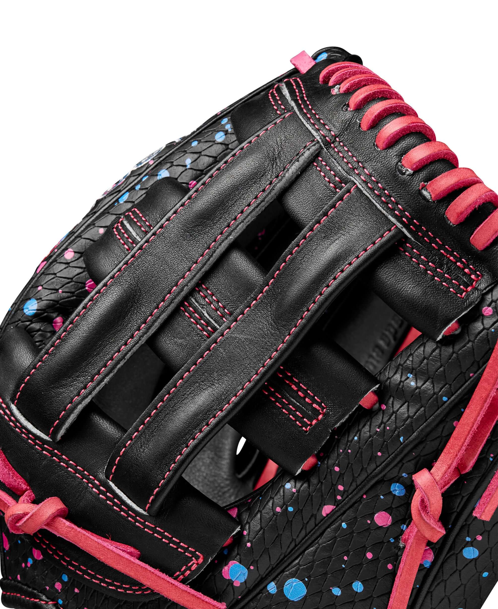 Close-up of Wilson A2000 Elly De La Cruz baseball glove showcasing black and pink SuperSnakeSkin™ and Dual Post Web design.