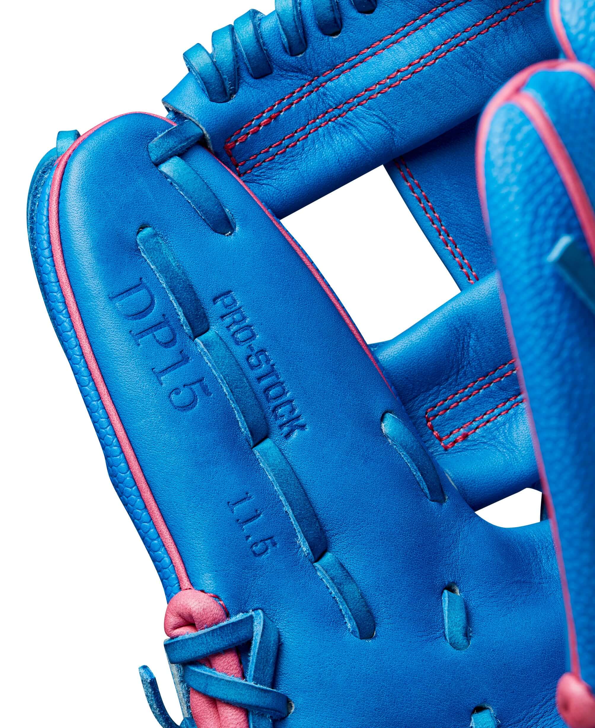 Close-up of Wilson 2024 Autism Speaks A2000 DP15SS baseball glove with blue leather and pink accents, highlighting the Pro Stock feature.