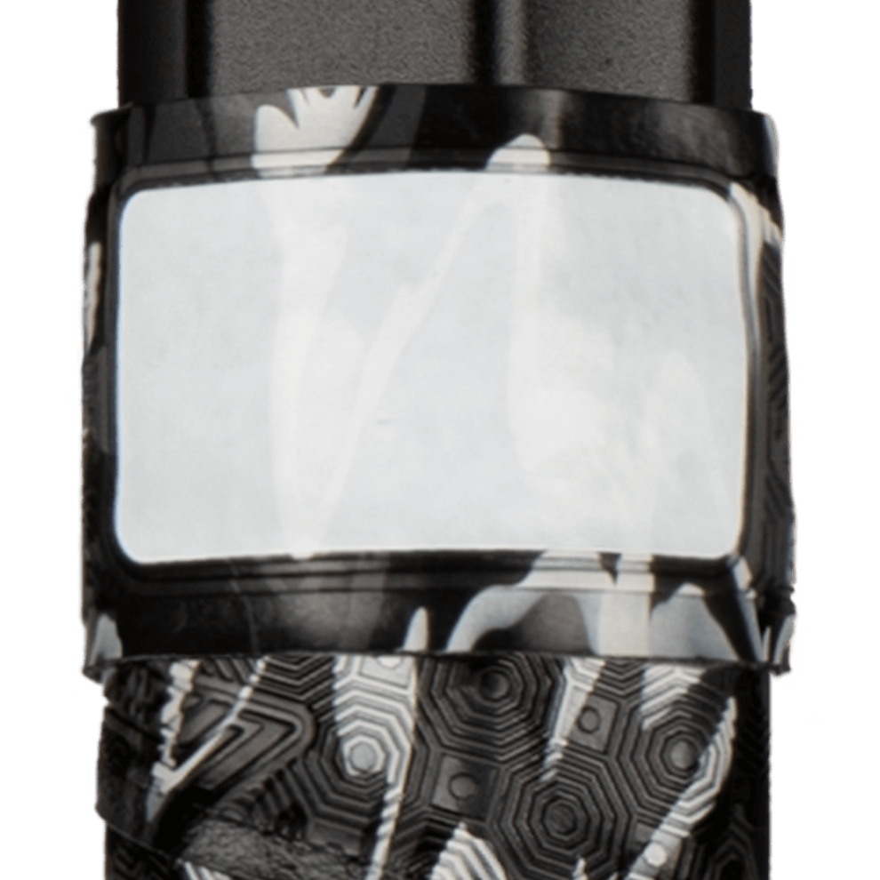 Close-up of Lizard Skins DSP Lacrosse Grip Tape V2 in black camo with a blank label for customization.