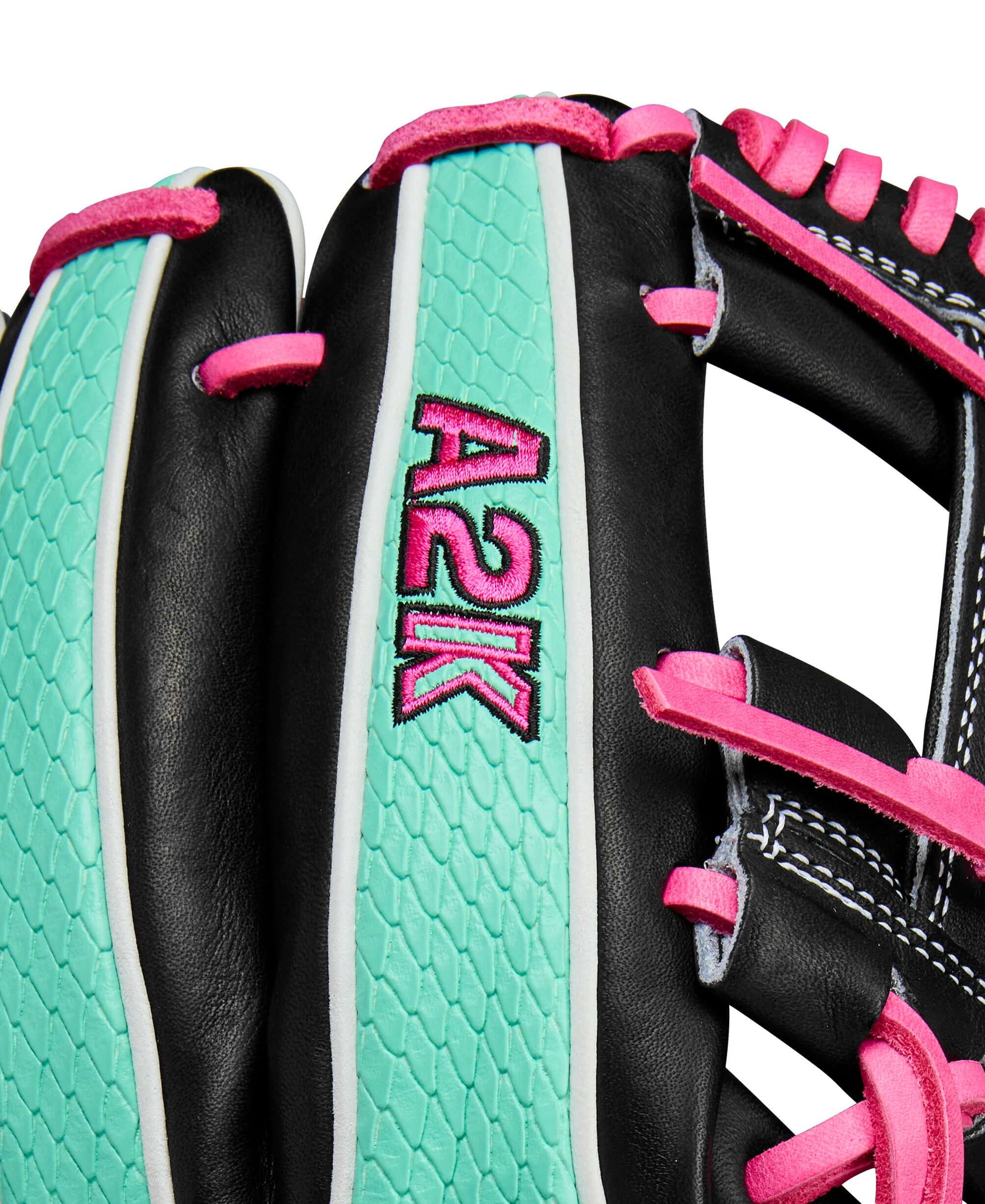 Close-up of Wilson A2K 1720SS baseball glove showing Black and Seafoam design with pink accents.