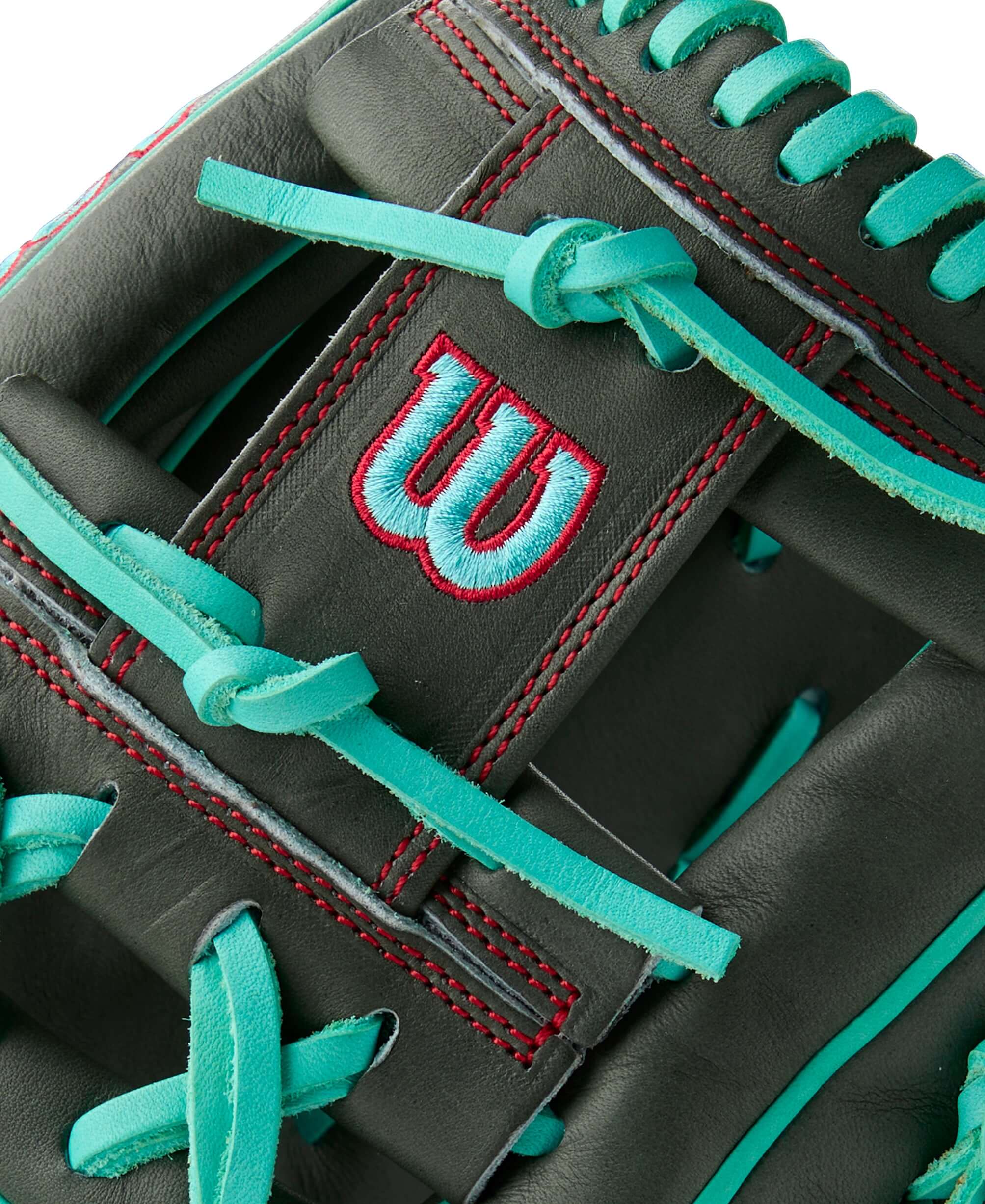Close-up of the Wilson A2000 infield baseball glove showcasing Coal leather and Seafoam laces, highlighting its quality craftsmanship.