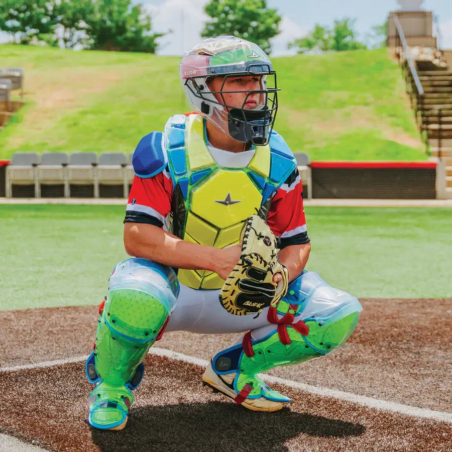Catcher wearing the All-Star MVP-PRO™ Chest Protector NOCSAE Small BK/BK in a squatting position on a baseball field.
