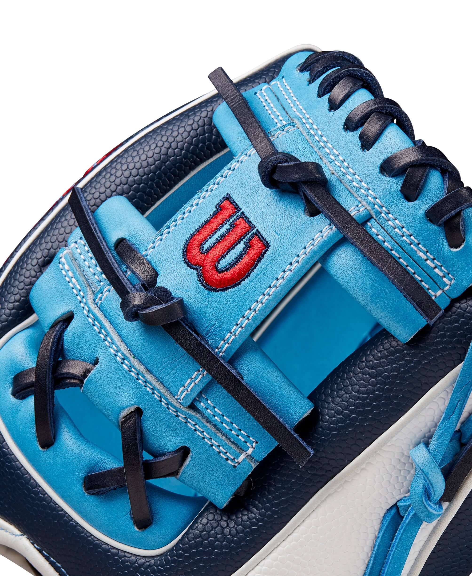 Close-up of Wilson Fall 2024 A2000 PF88SS infield baseball glove with navy and sky blue detailing and red logo.
