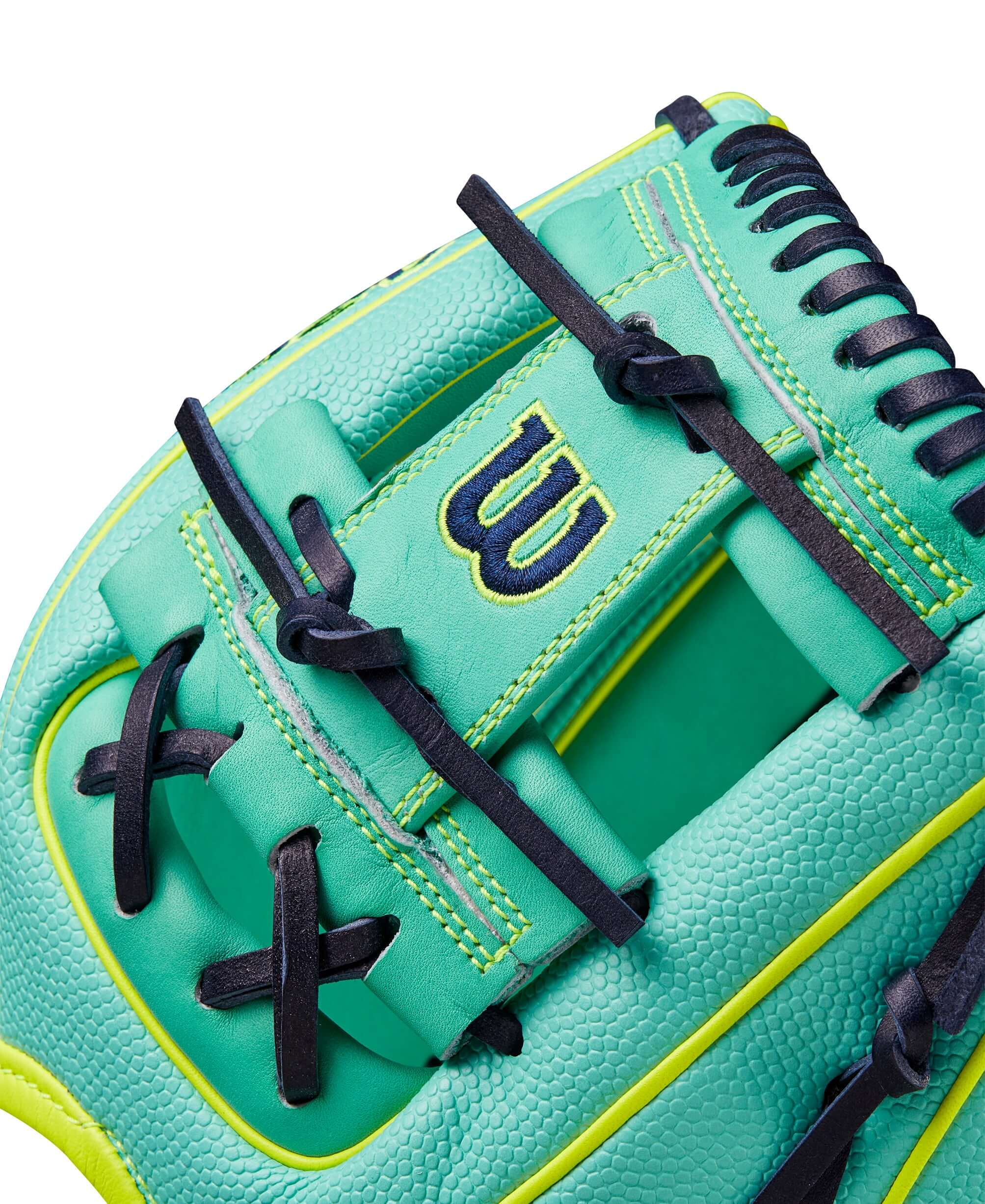 Close-up of Wilson Fall 2024 A2000 DP15SS baseball glove in seafoam with black laces and optic yellow accents.