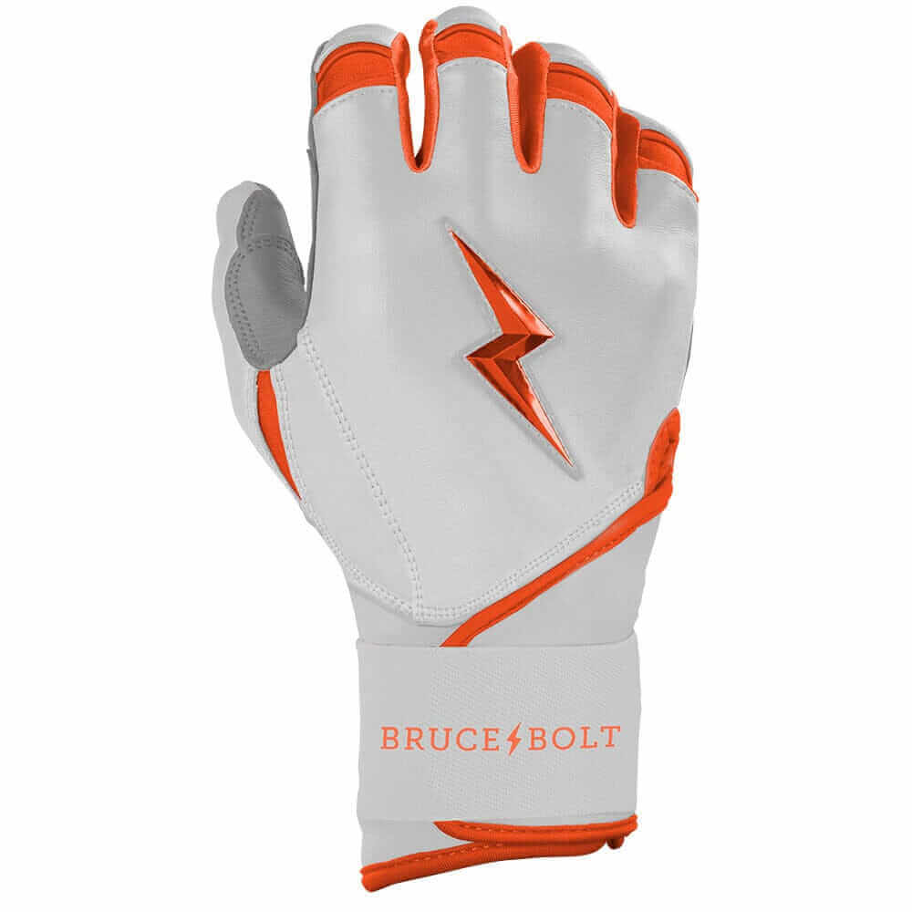 Close-up view of the right hand wearing Bruce Bolt Youth Premium Pro Chrome Short Cuff Batting Glove Orange