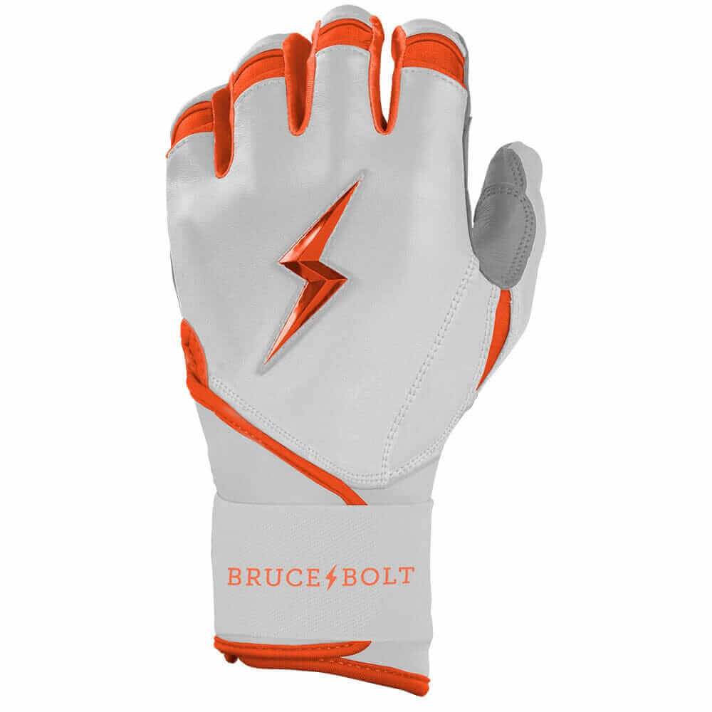 Close-up view of the left hand wearing Bruce Bolt Youth Premium Pro Chrome Short Cuff Batting Glove Orange.