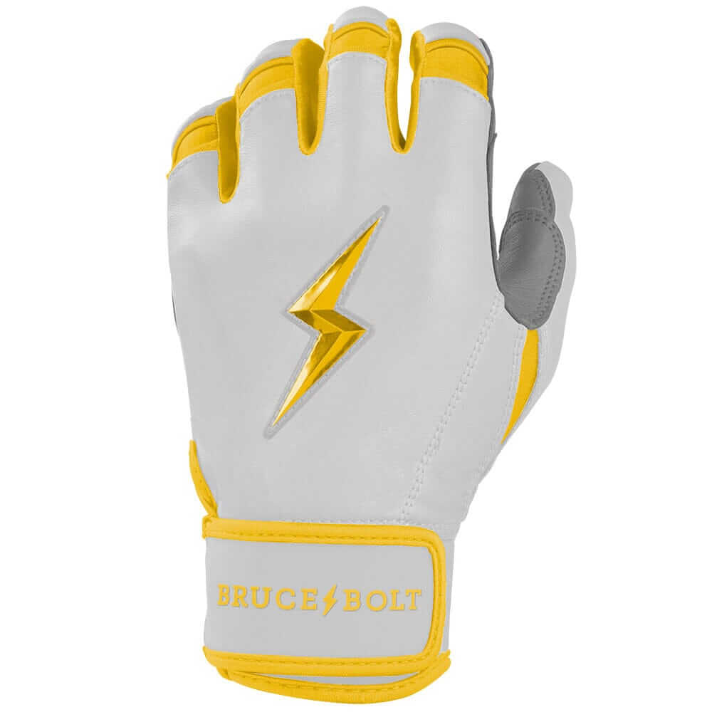 Close-up view of the left hand wearing Bruce Bolt Youth Premium Pro Chrome Short Cuff Batting Glove Yellow.