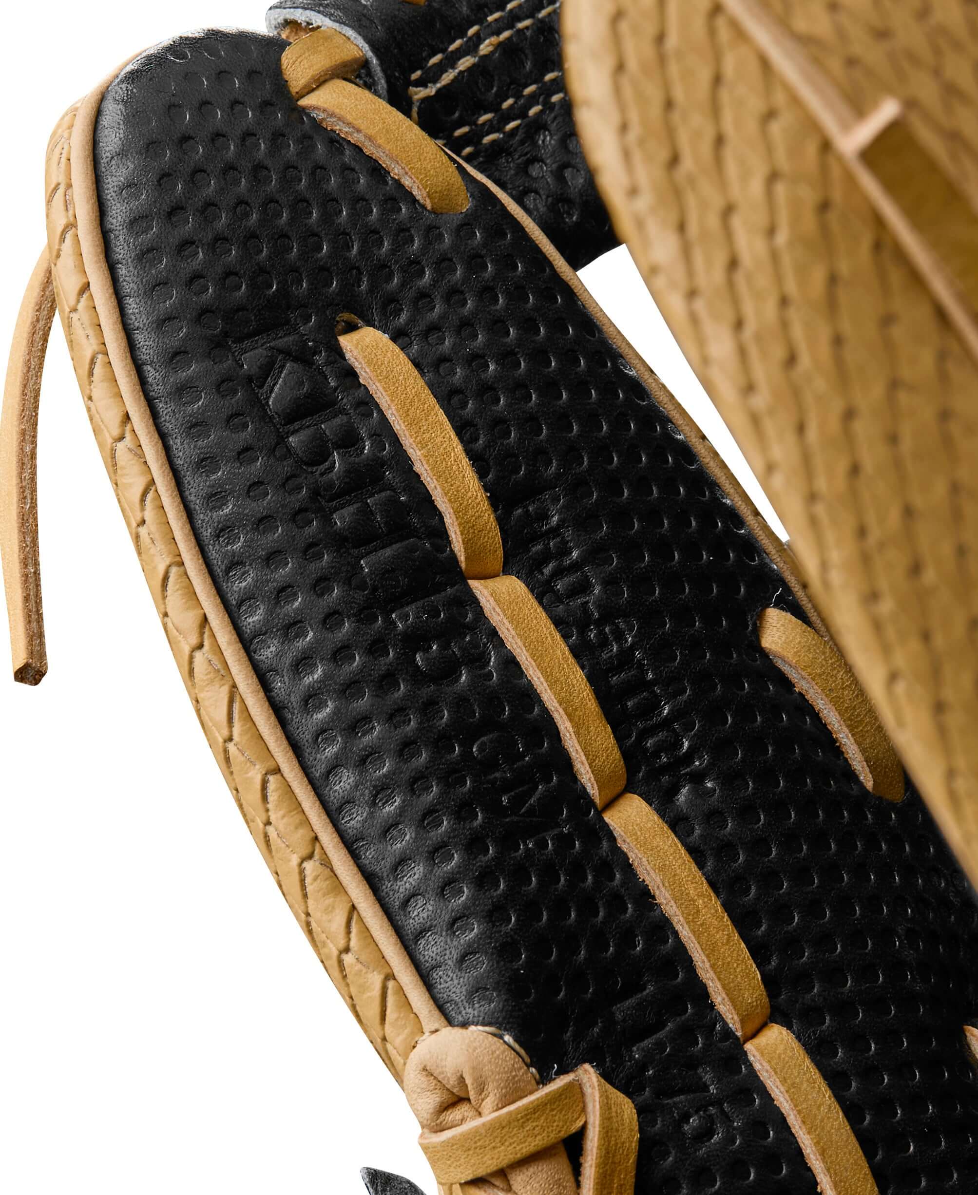 Detailed thumb view showing the precision craftsmanship and rolled dual welting for durability