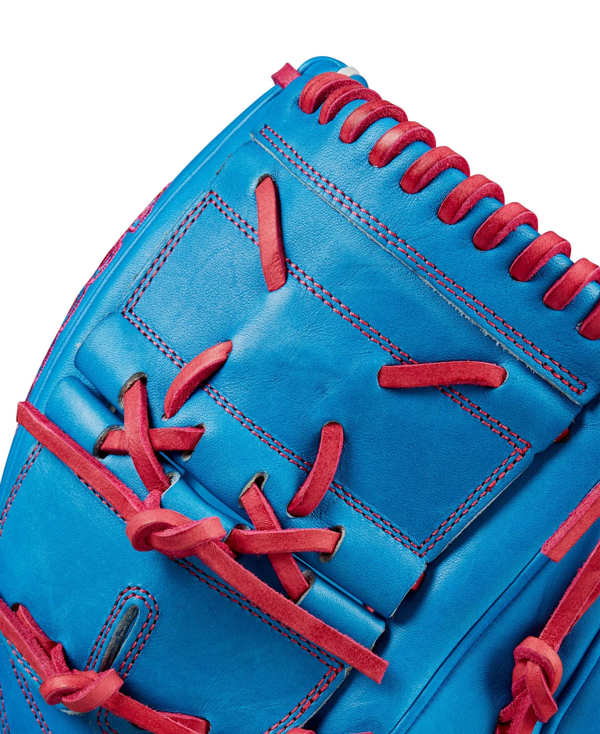 Close-up of Wilson 2024 Autism Speaks A2000 B2 pitcher's glove showcasing blue Pro Stock leather and pink accents.