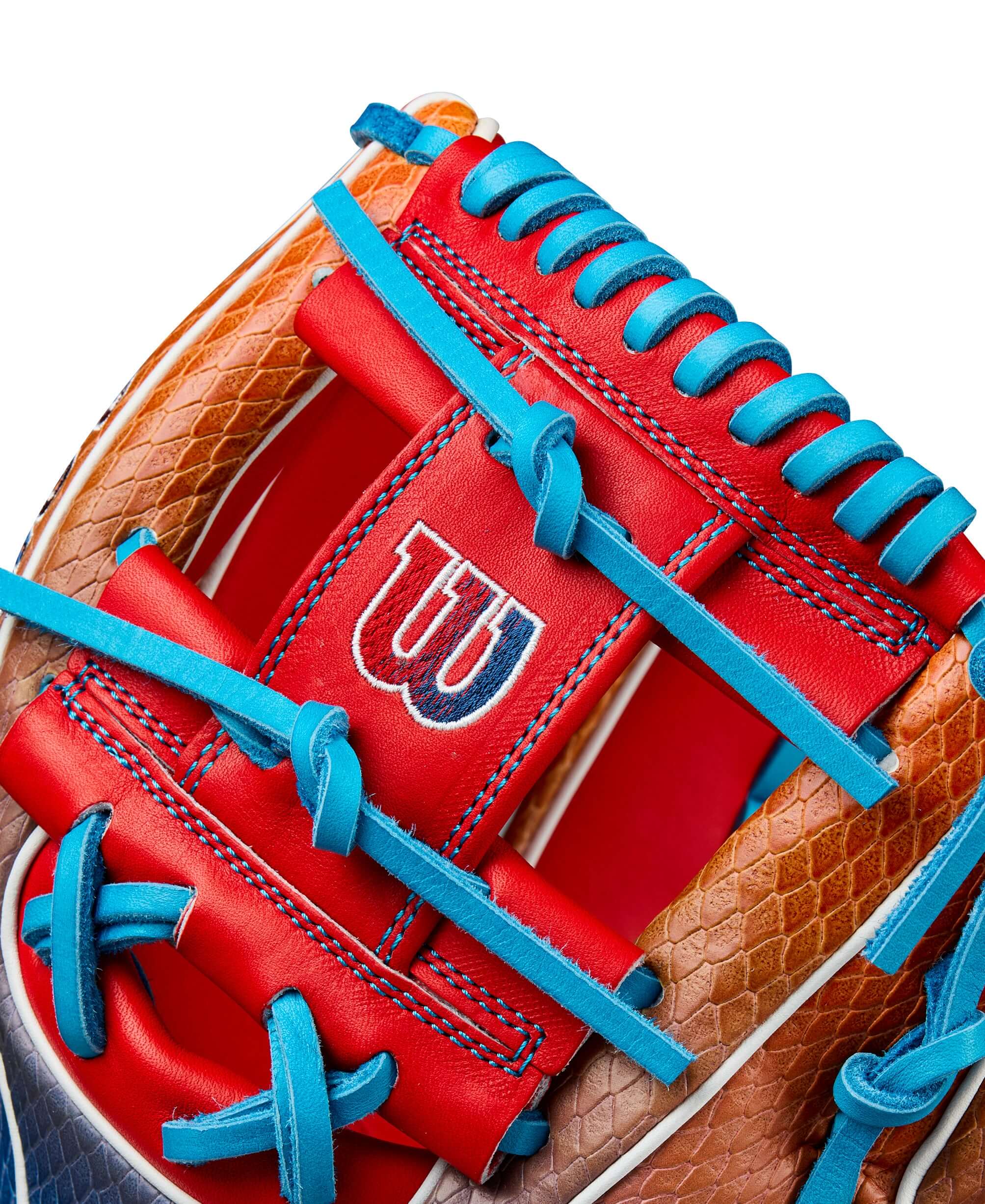 Close-up of Wilson A2K 1786SS glove featuring red and blue gradient SuperSnakeSkin material and H-Web design.
