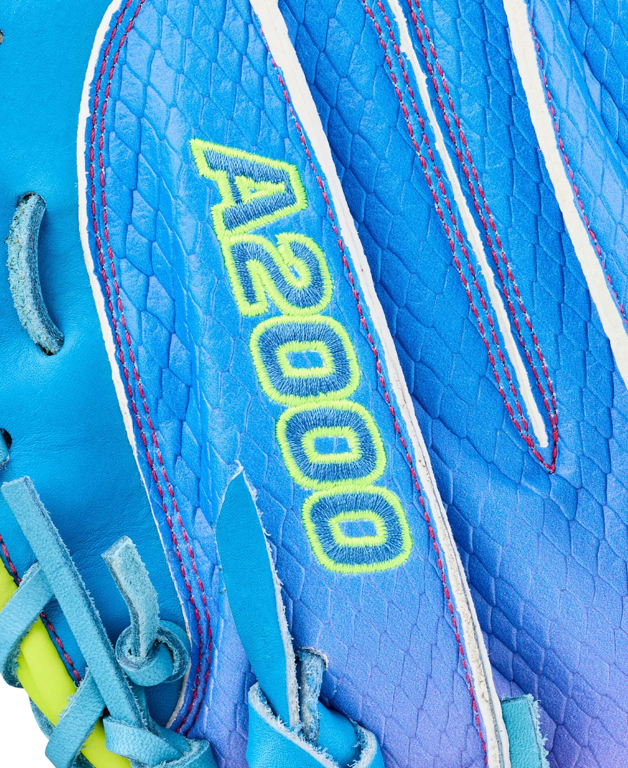 Wilson 2026 Love the Moment A2000 CM33SS 33” Baseball Catcher’s Mitt web detail with blue leather and neon yellow lacing.