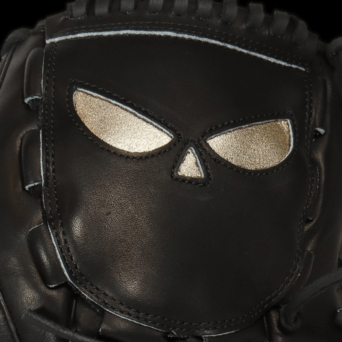 Close-up of Shadow 13 Slinger glove showing fierce design and brass inlays for pitchers.