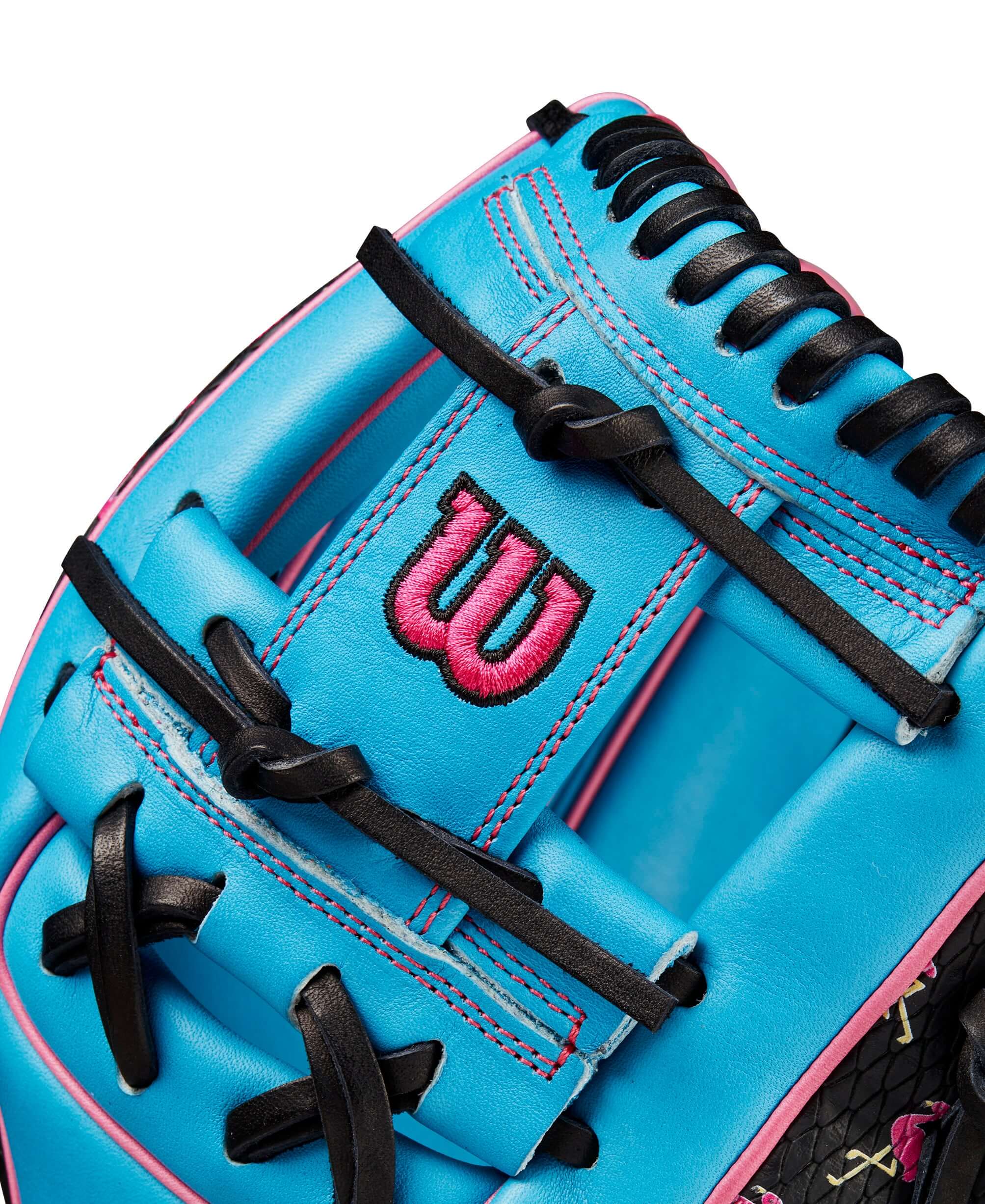 Close-up of Wilson A2000 1786 glove featuring Tropical Blue leather and pink Flamingo design accents.