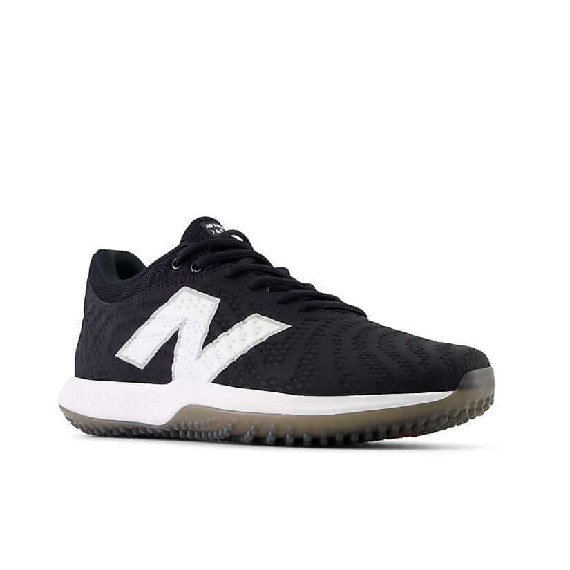 New Balance FuelCell 4040v7 Turf Trainer in black with white logo, perfect for ballplayers and versatile training.