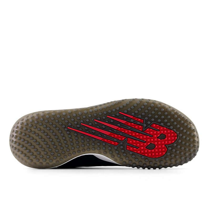 New Balance FuelCell 4040v7 Turf Trainer outsole featuring aggressive rubber design and red logo for traction on turf.