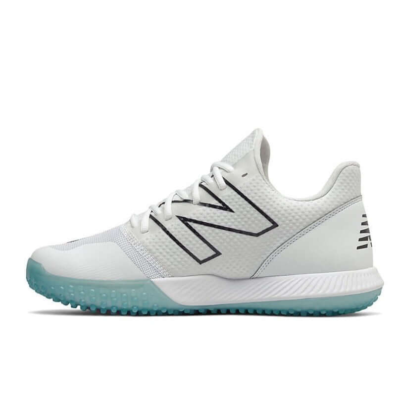 New Balance FuelCell T4040v6 baseball turf shoes in white with synthetic mesh upper and nubby rubber outsole for traction.