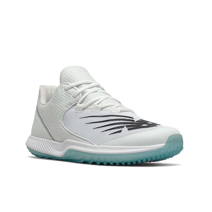 New Balance FuelCell T4040v6 baseball turf shoes in white with black accents and a rubber outsole for traction.