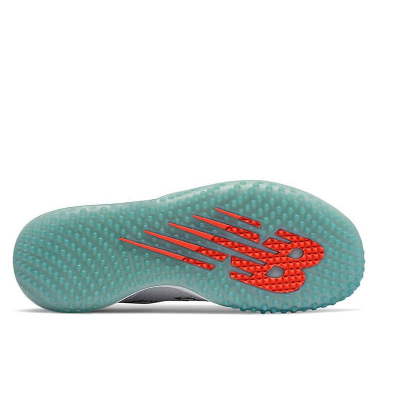 Bottom view of New Balance FuelCell T4040v6 baseball turf shoes showcasing nubby rubber outsole and traction design.