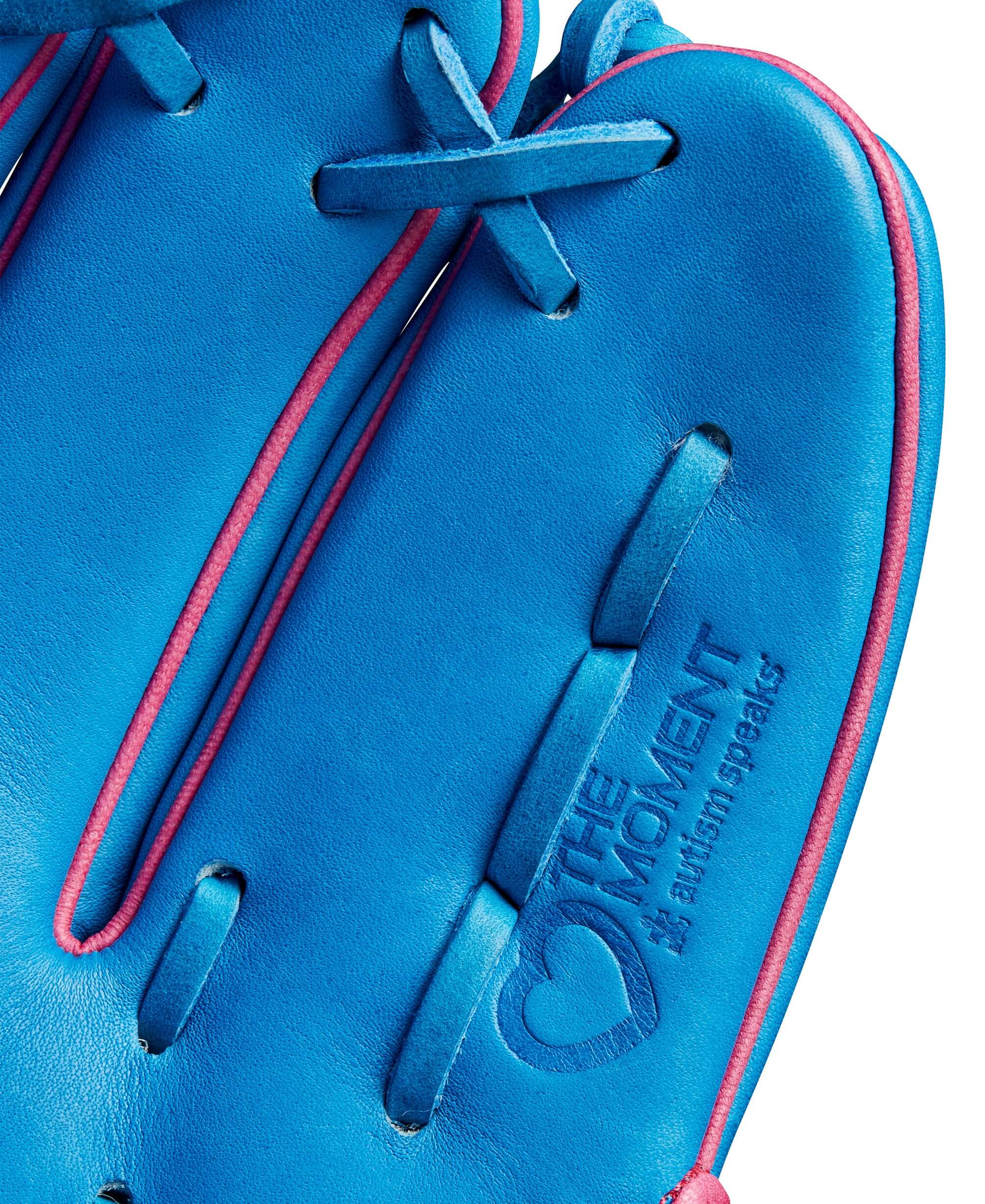 Close-up of the Wilson Autism Speaks A2000 glove featuring blue leather and pink accents with logo detail.