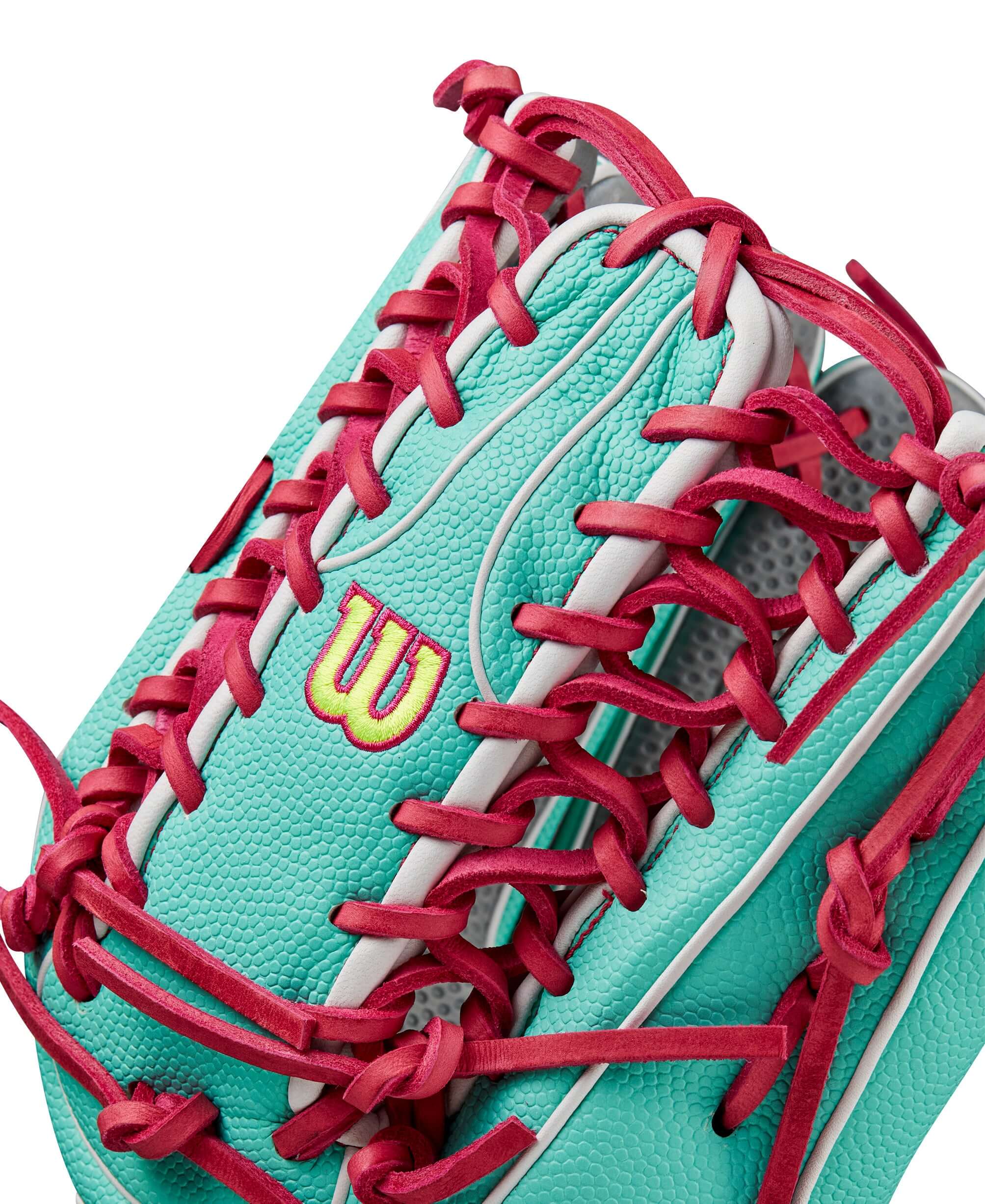 Wilson Spring 2025 A2000 SCOT7SS glove in seafoam and flamingo colors showcasing its intricate lace design.